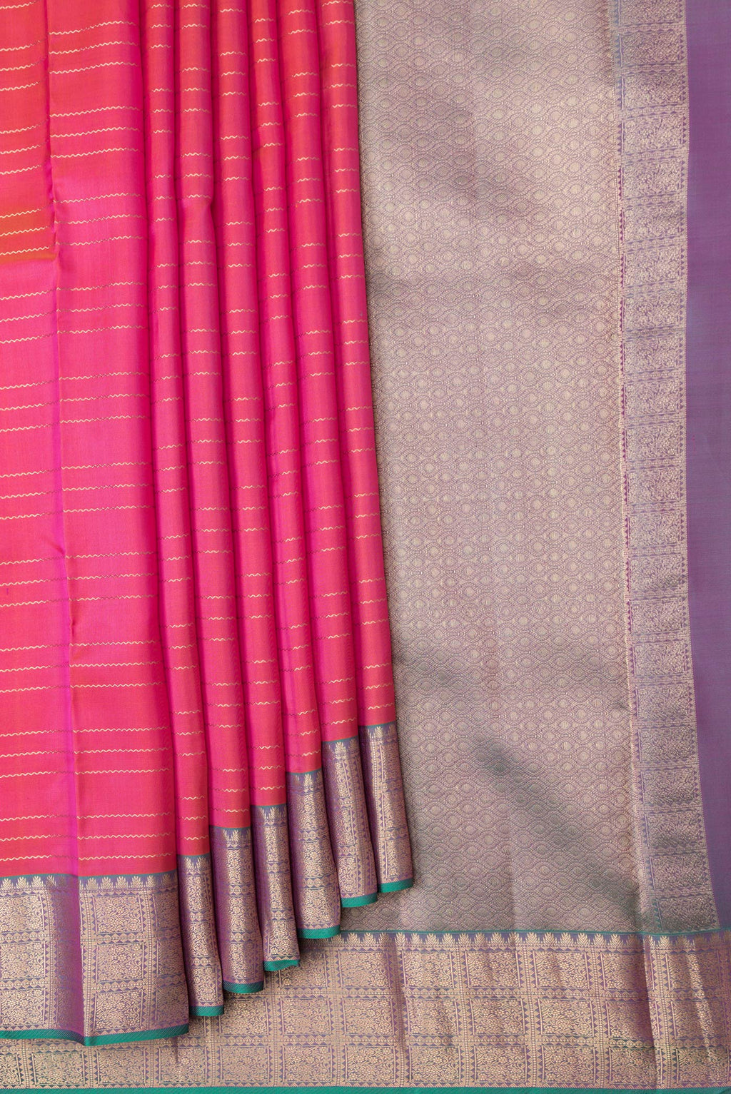 Pleats and pallu of Orange Dual Tone Kanchipuram Silk Saree with Stripes on the body and Zari Border. 