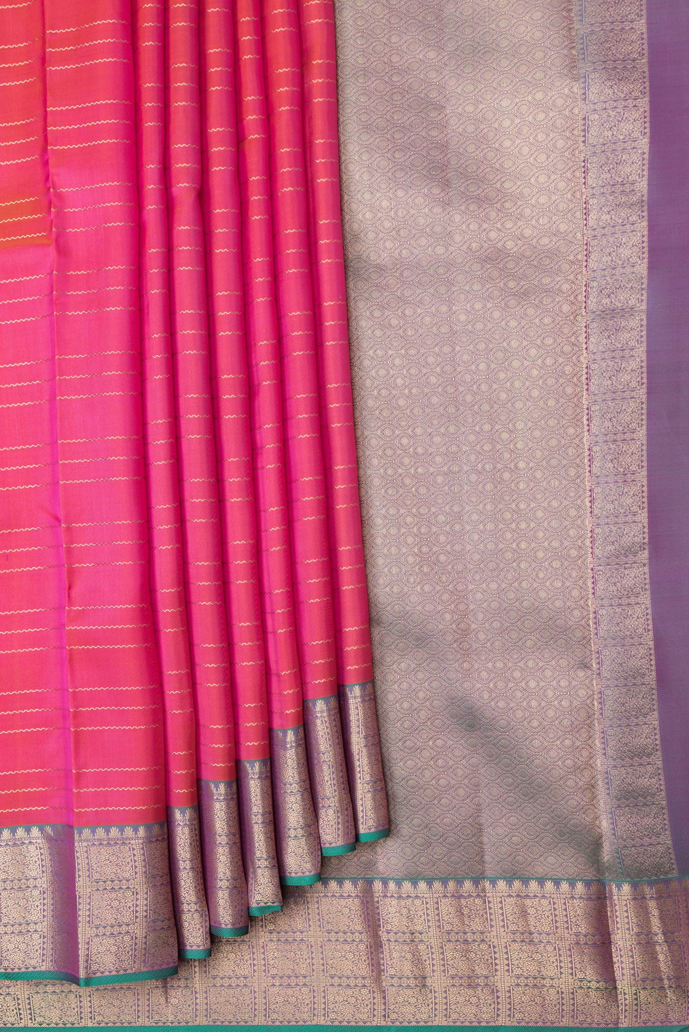 Pleats and pallu of Orange Dual Tone Kanchipuram Silk Saree with Stripes on the body and Zari Border. 