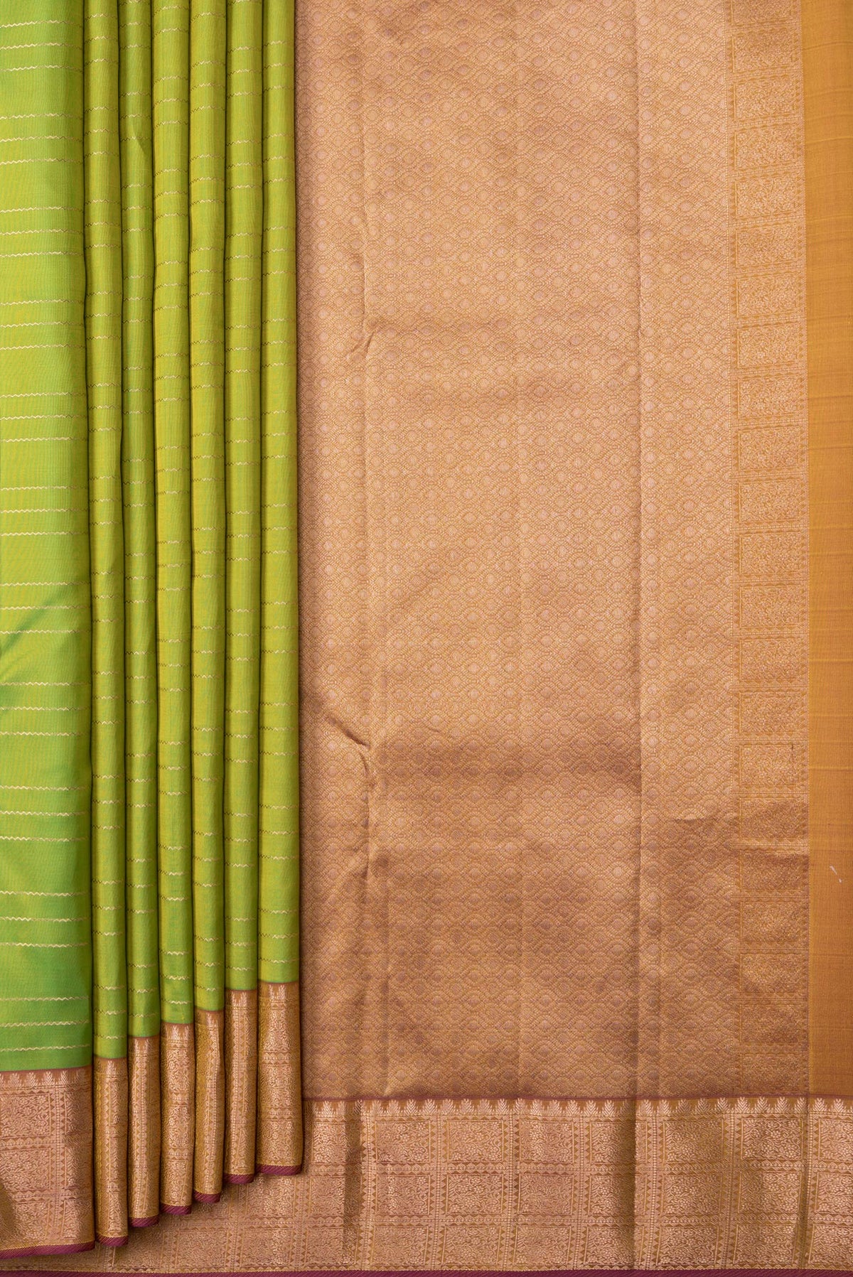Pleats and pallu of Parrot Green Dual Tone Kanchipuram Silk Saree with Stripes on the body and Zari Border. 