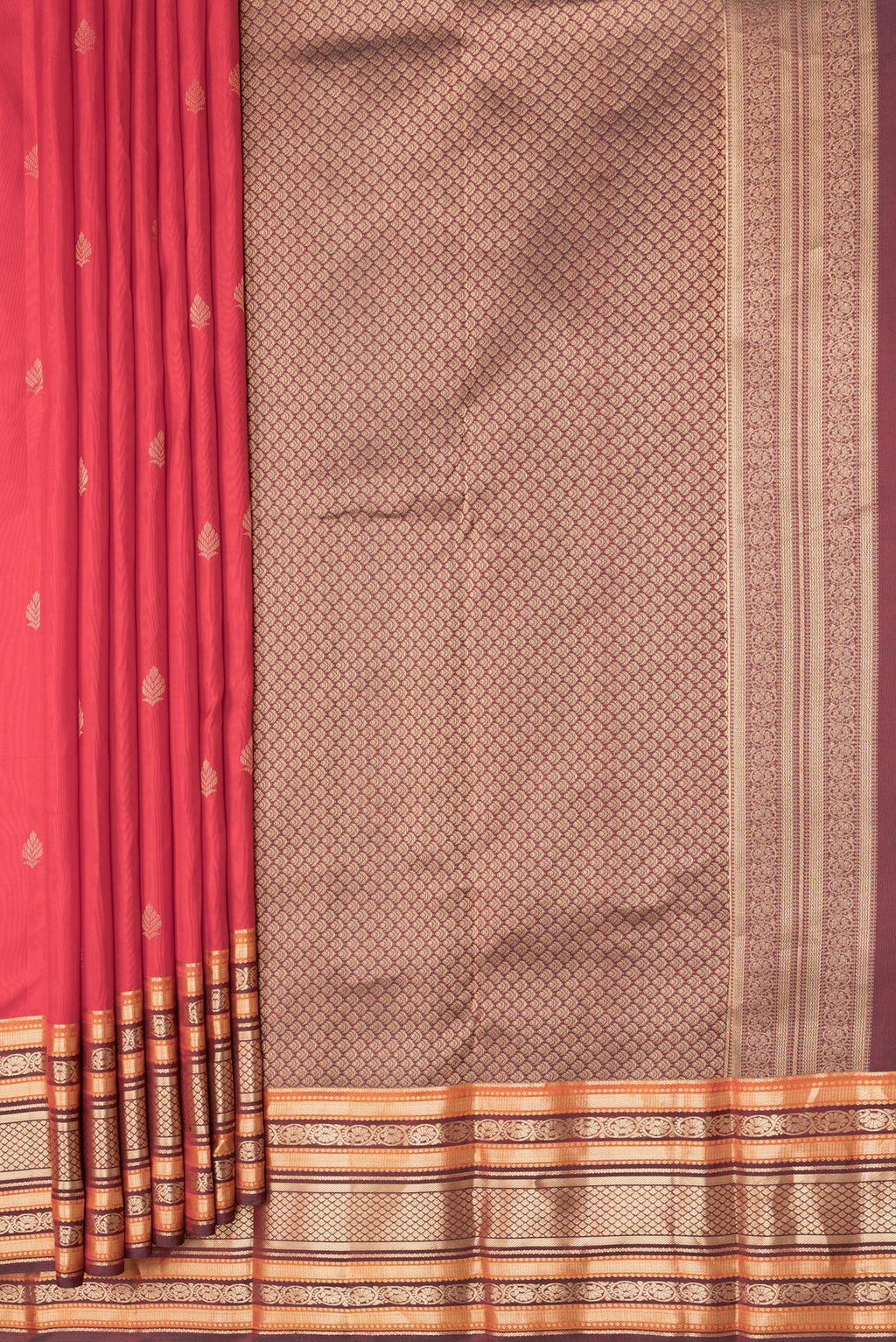 Pleats and pallu of Red Dual Tone Kanchipuram Silk Saree with Zari Butta on the body and Zari Border. 