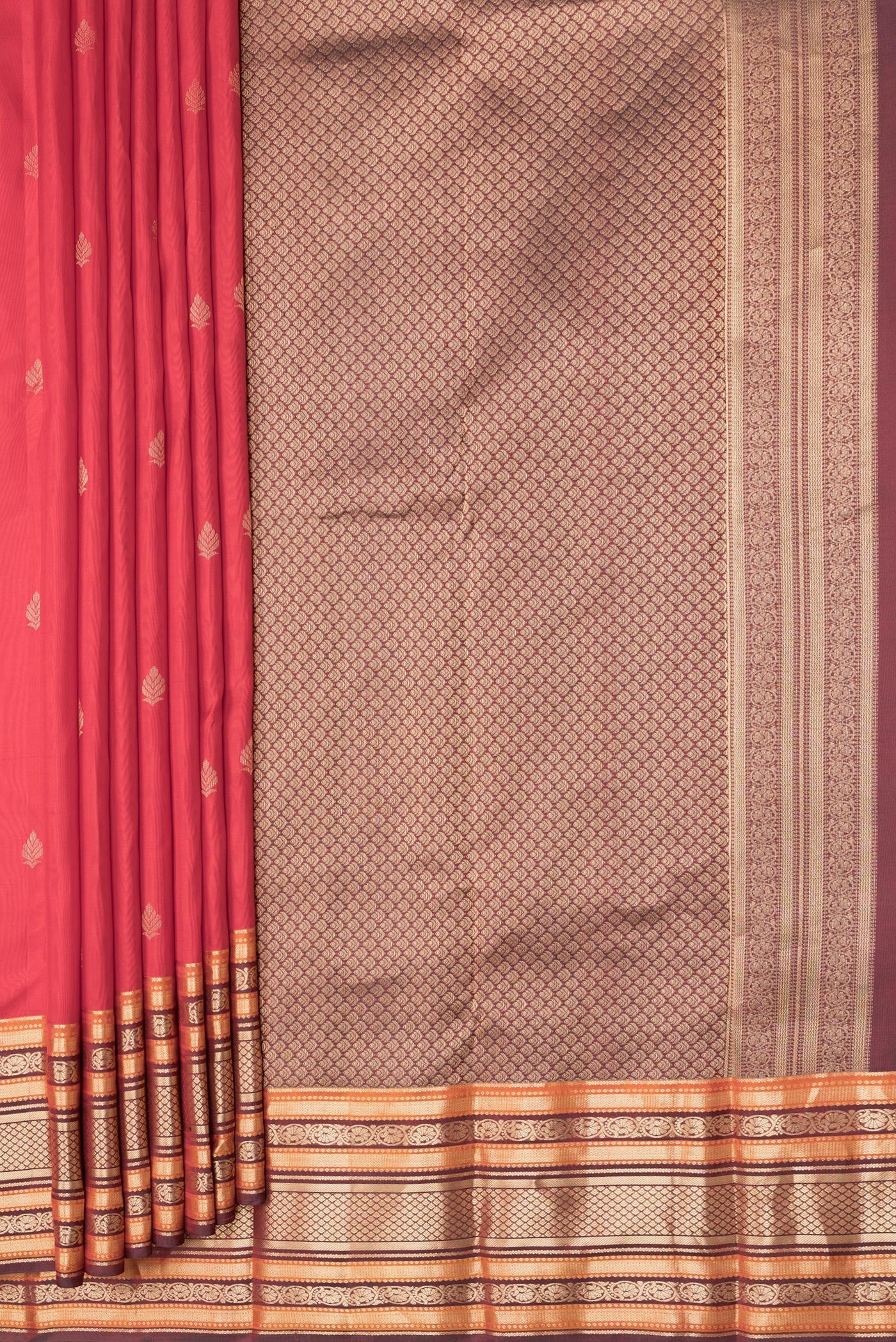 Pleats and pallu of Red Dual Tone Kanchipuram Silk Saree with Zari Butta on the body and Zari Border. 