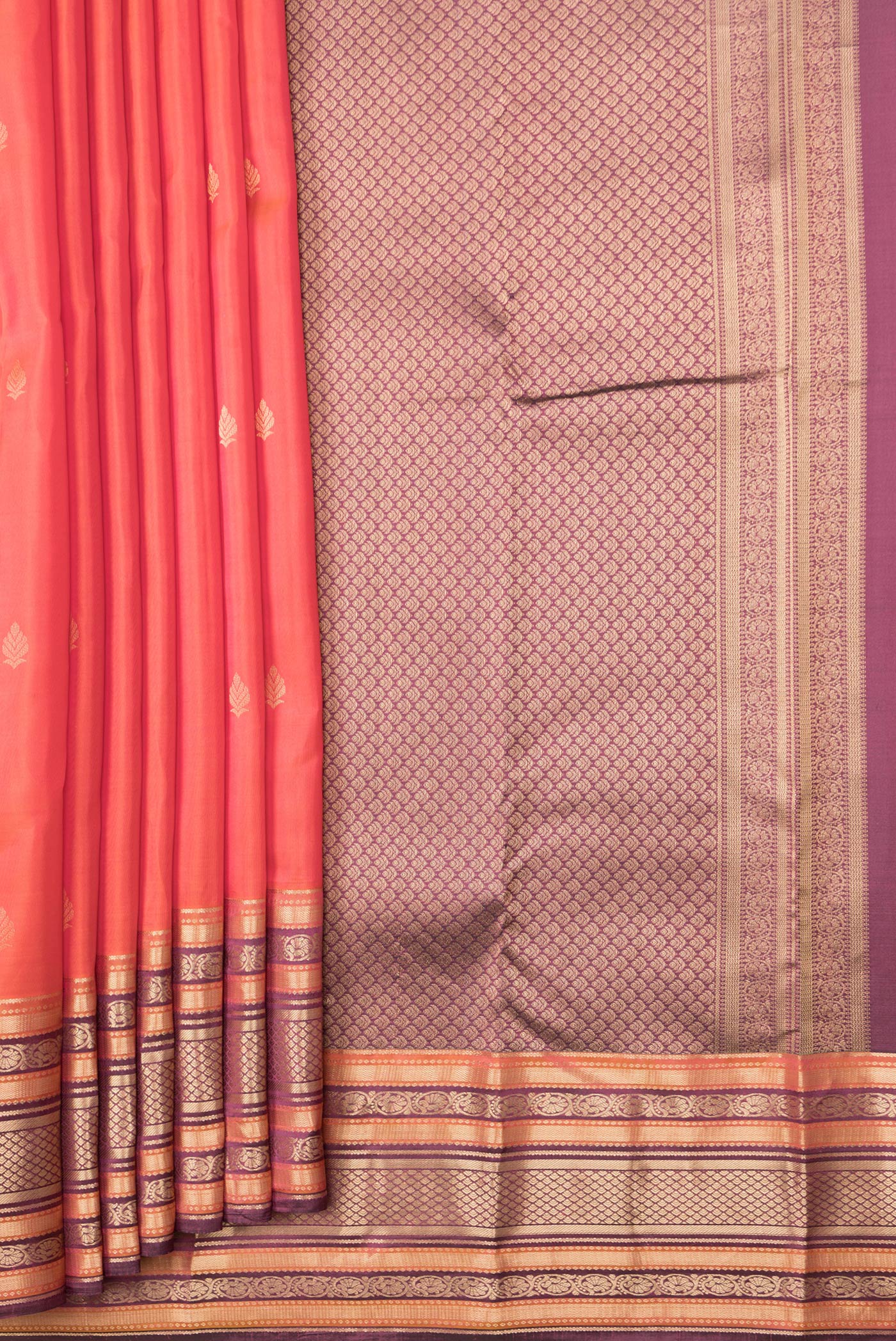 Pleats and pallu of Orange Dual Tone Kanchipuram Silk Saree with Zari Butta on the body and Zari Border. 