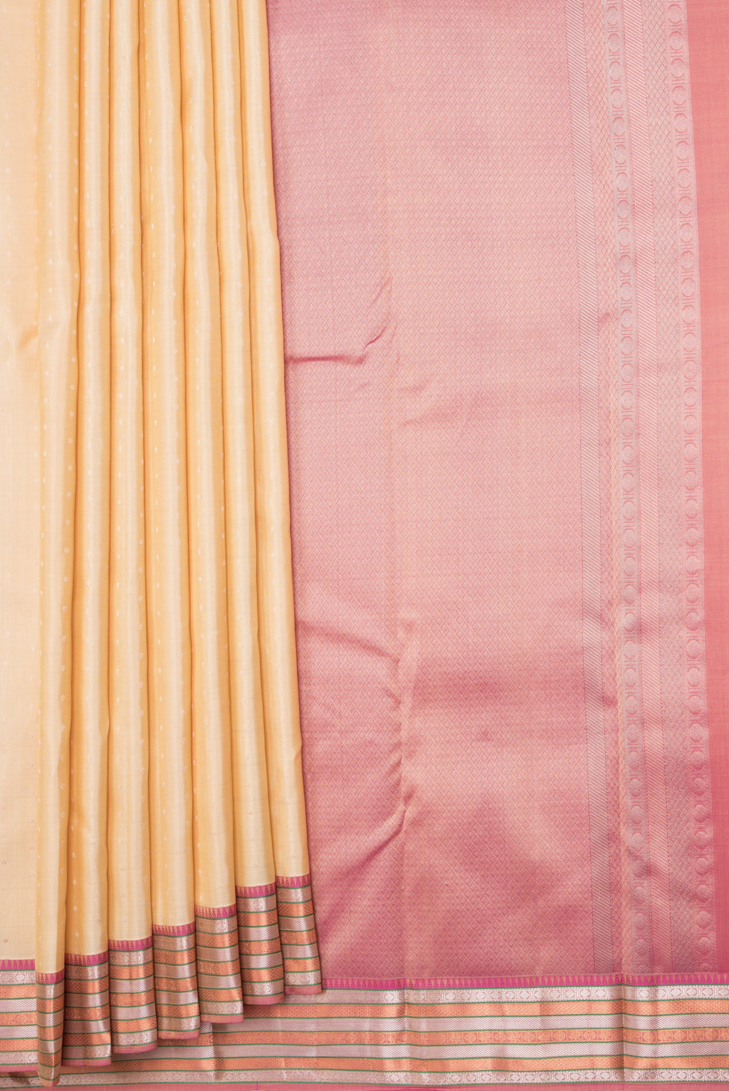 Pleats and pallu of Beige Dual Tone Kanchipuram Silk Saree with Zari Butta on the body and Zari Border. 