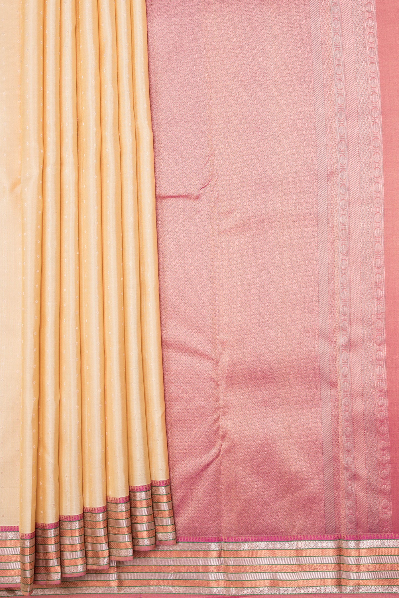 Pleats and pallu of Beige Dual Tone Kanchipuram Silk Saree with Zari Butta on the body and Zari Border. 