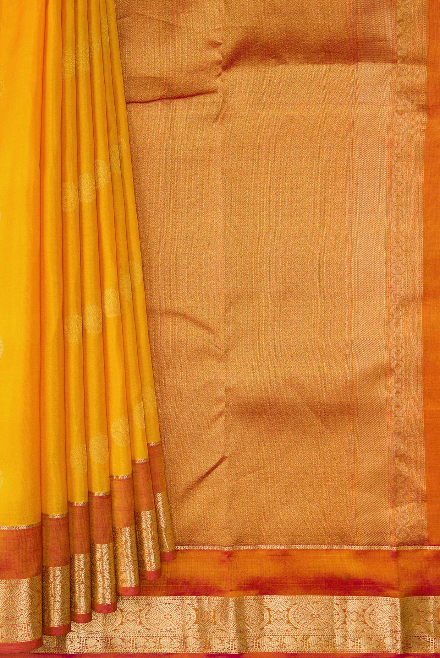 Pleats and pallu of Mustard Dual Tone Kanchipuram Silk Saree with Zari Butta on the body and Zari Border. 