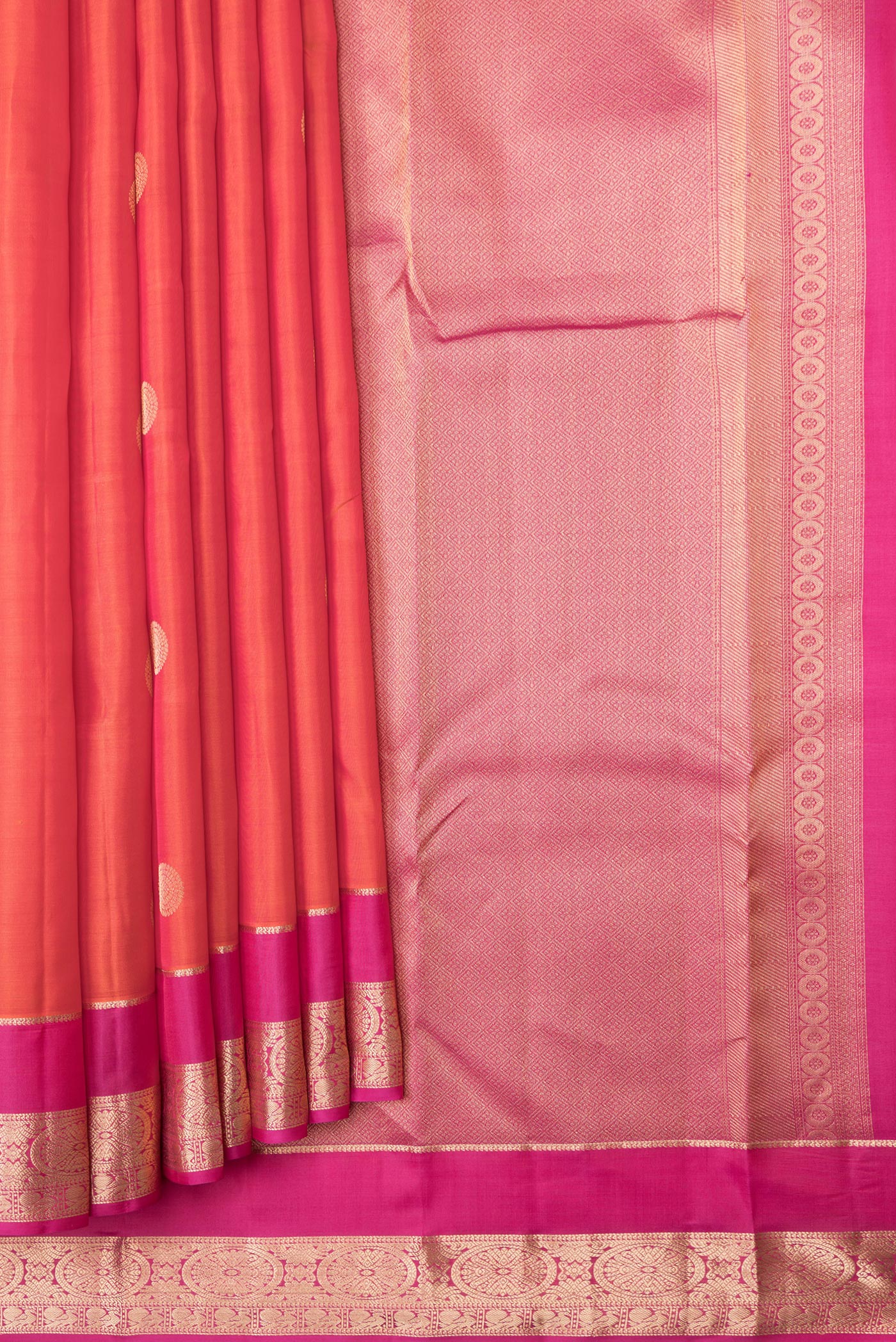 Pleats and pallu of Orange Dual Tone Kanchipuram Silk Saree with Zari Butta on the body and Zari Border. 