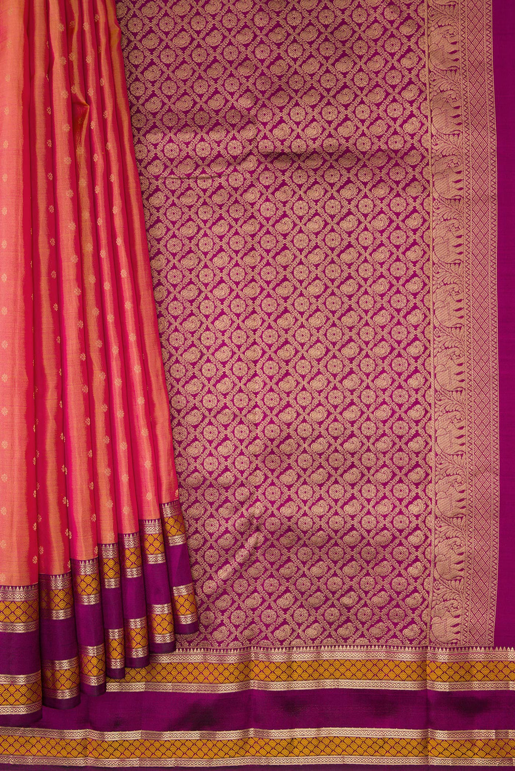 Pleats and pallu of Coral Dual Tone Kanchipuram Silk Saree with Zari Butta on the body and Zari And Thread Border. 