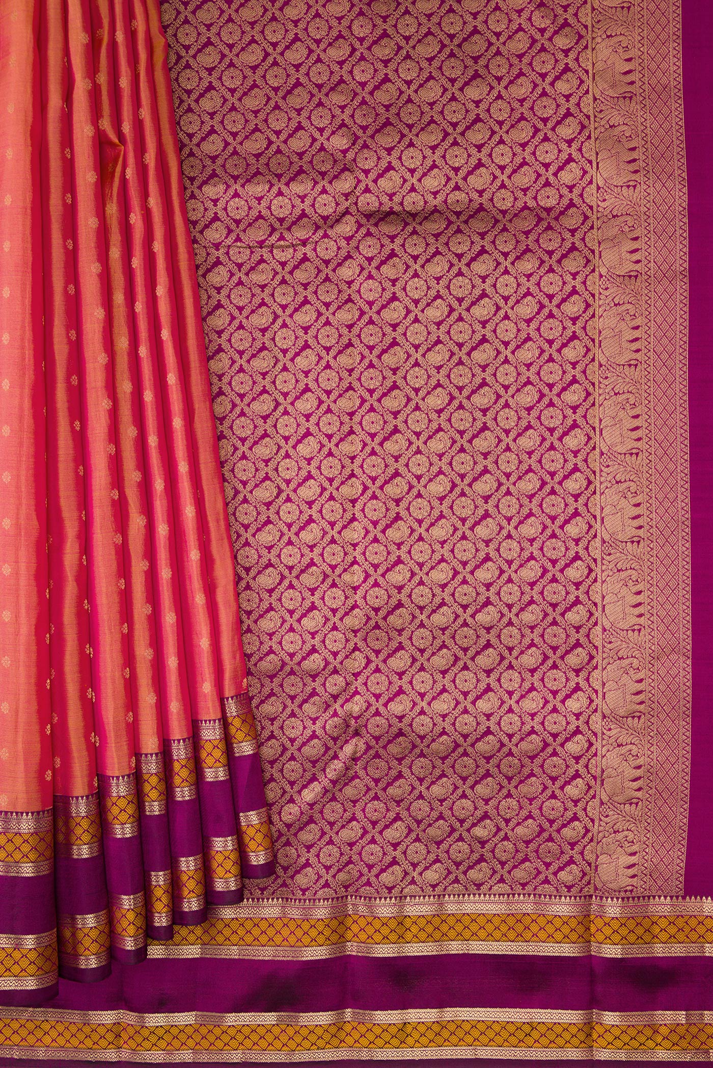 Pleats and pallu of Coral Dual Tone Kanchipuram Silk Saree with Zari Butta on the body and Zari And Thread Border. 