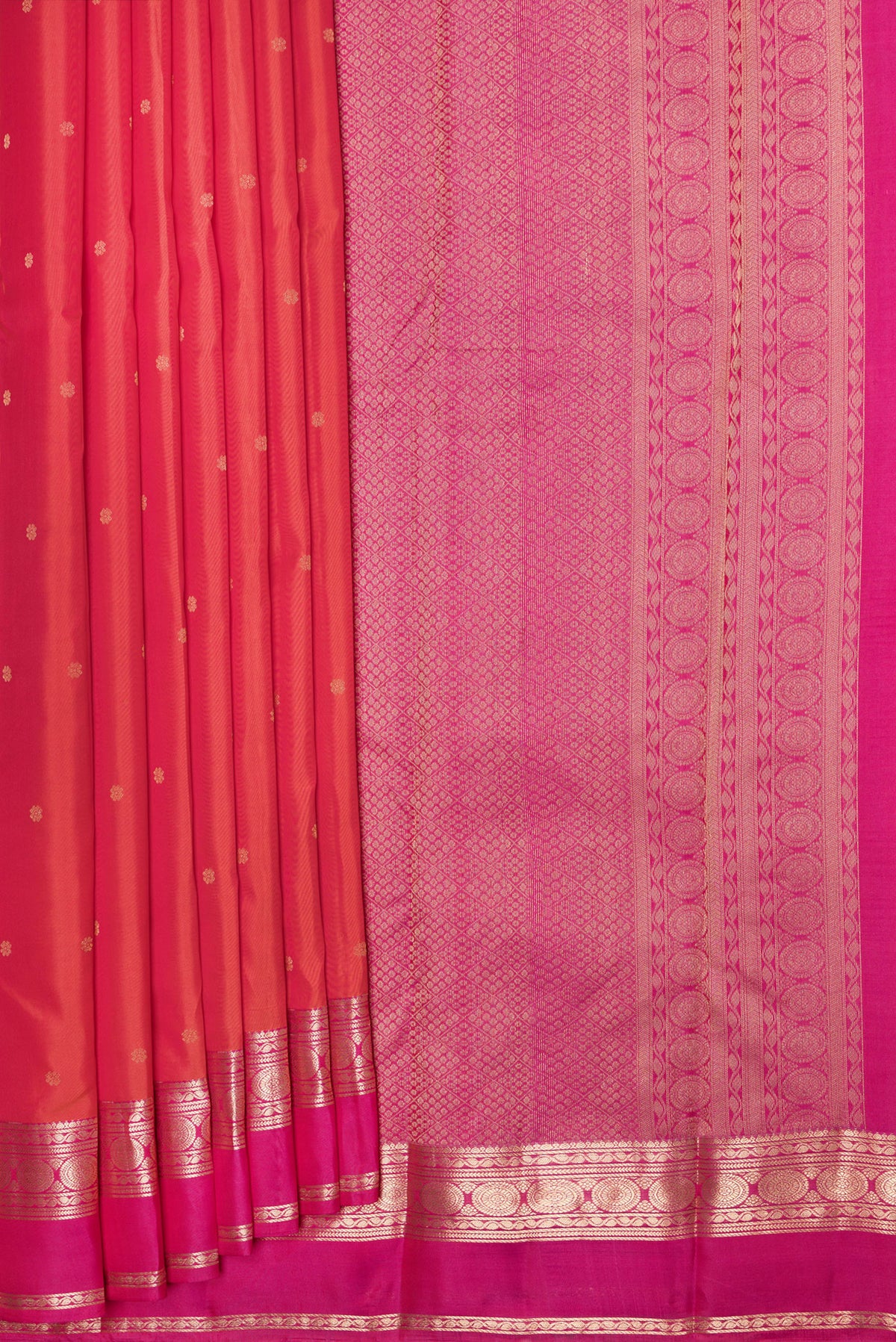 Pleats and pallu of Orange Dual Tone Kanchipuram Silk Saree with Zari Butta on the body and Zari Border. 