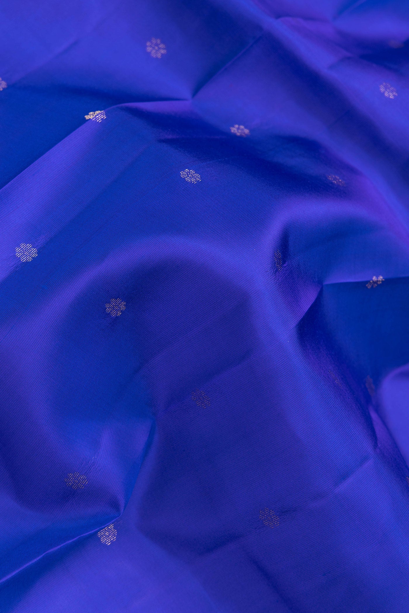 Close up of Royal Blue Dual Tone Kanchipuram Silk Saree with Stripes on the body and Ganga Jamuna Border.  displaying folds