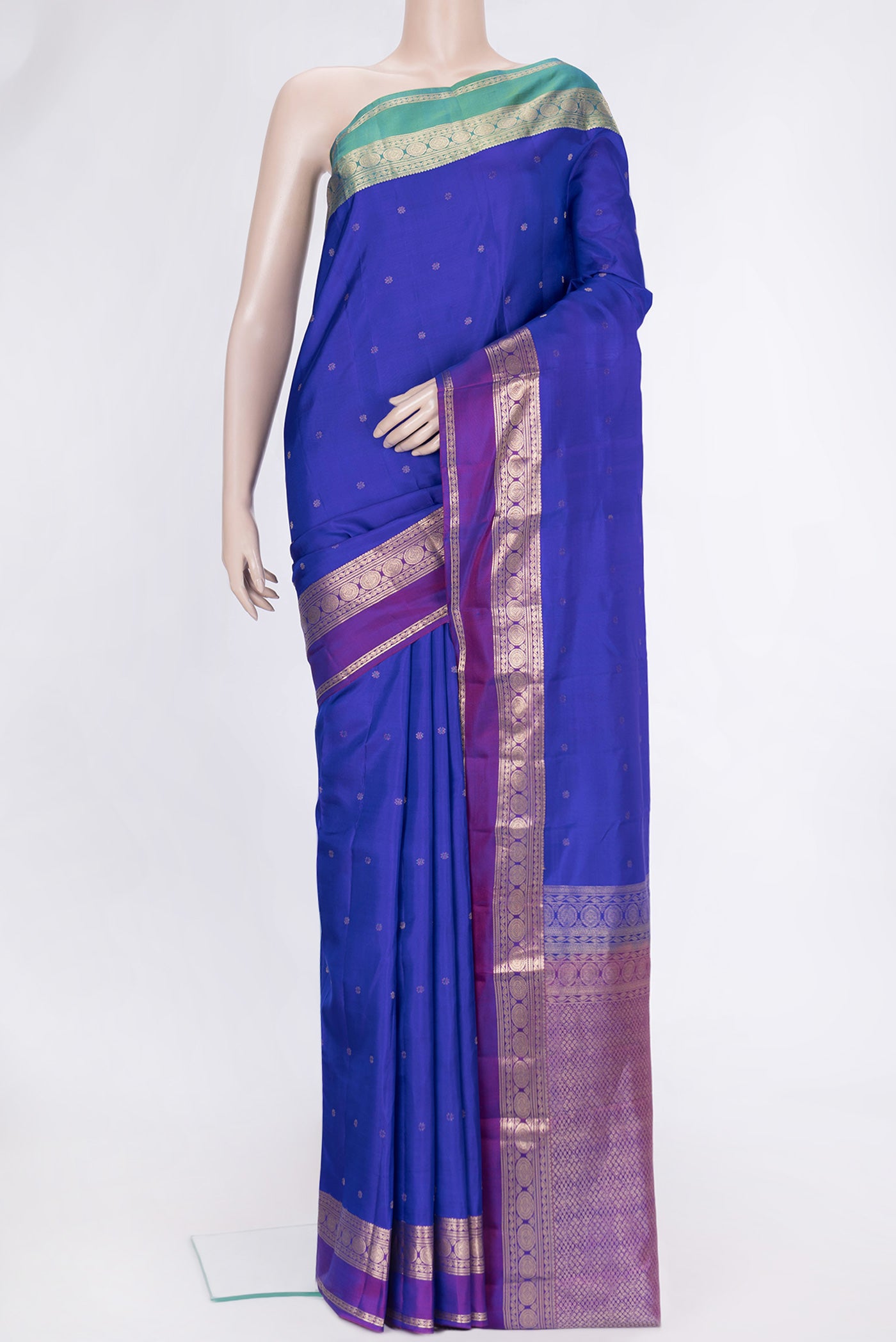 Royal Blue Dual Tone Kanchipuram Silk Saree with Stripes on the body and Ganga Jamuna Border.  displayed on a mannequin