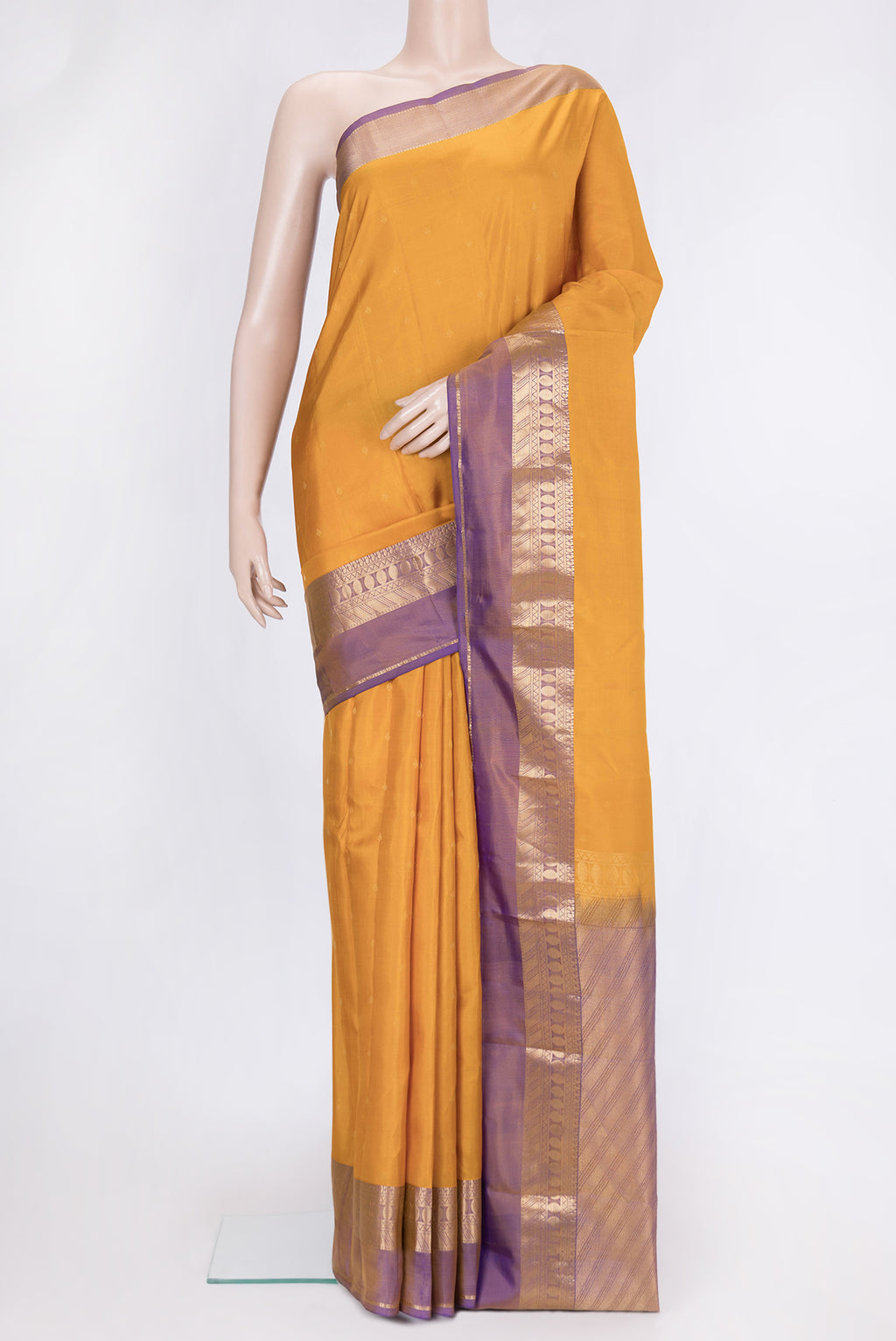 Mustard Dual Tone Kanchipuram Silk Saree with Zari Butta on the body and Zari Border.  displayed on a mannequin