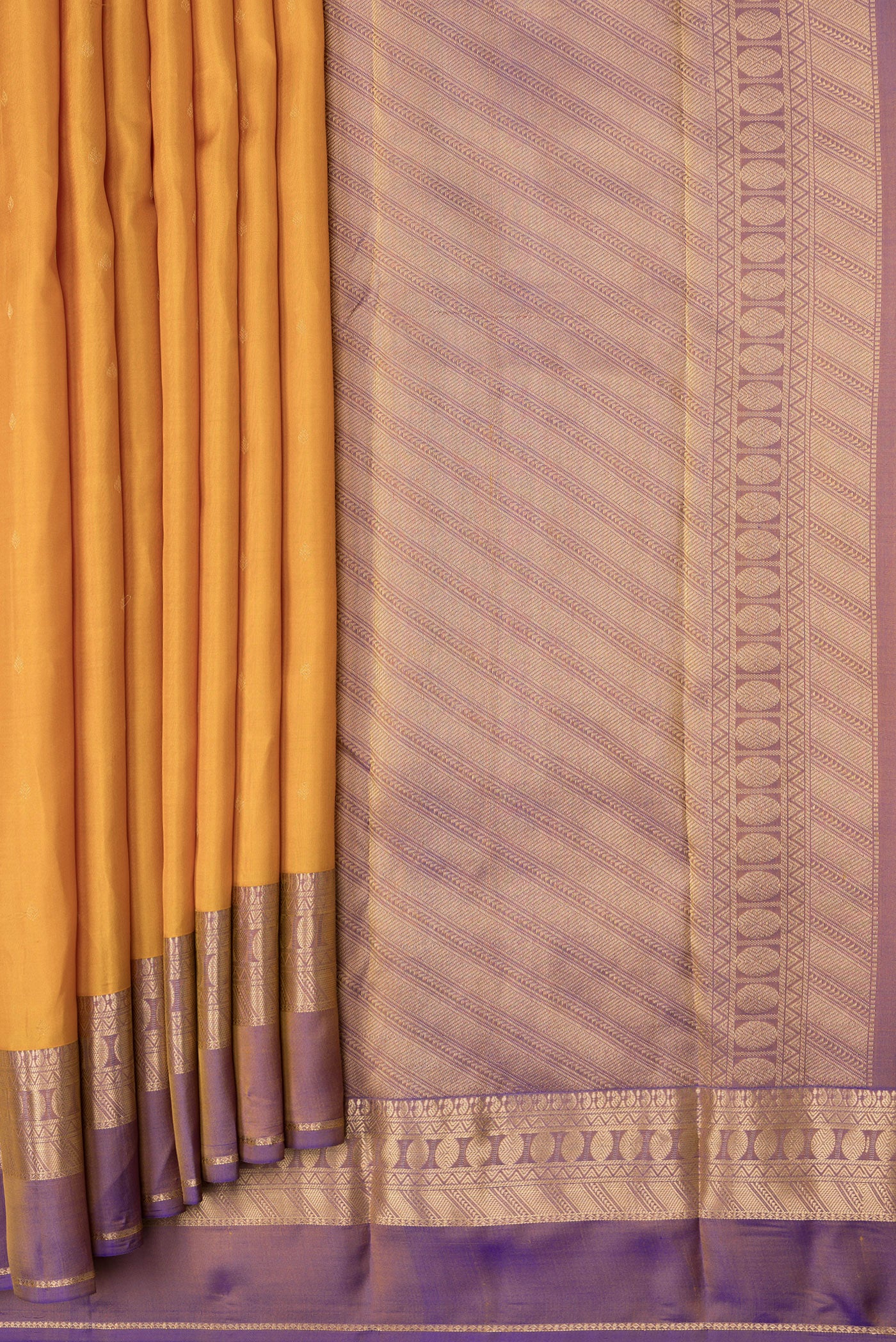 Pleats and pallu of Mustard Dual Tone Kanchipuram Silk Saree with Zari Butta on the body and Zari Border. 