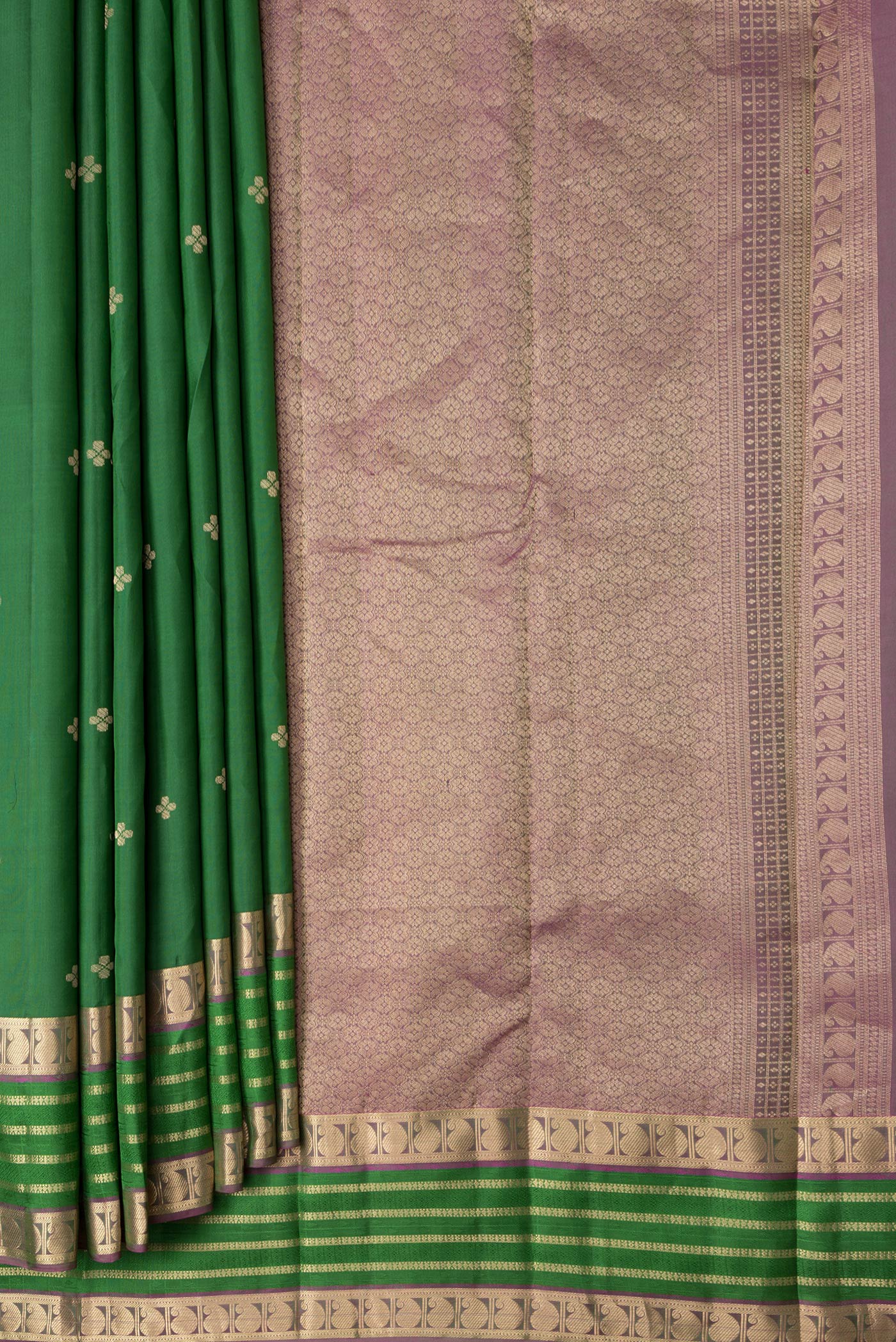 Pleats and pallu of Bottle Green Dual Tone Kanchipuram Silk Saree with Zari Butta on the body and Zari And Thread Border. 