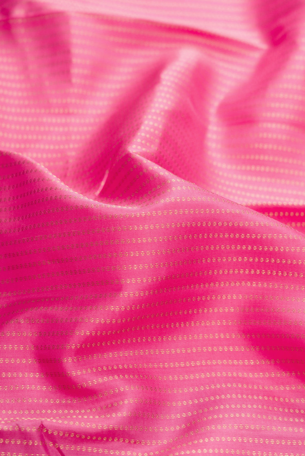 Close up of Pink Dual Tone Kanchipuram Silk Saree with Stripes on the body and Zari Border.  displaying folds
