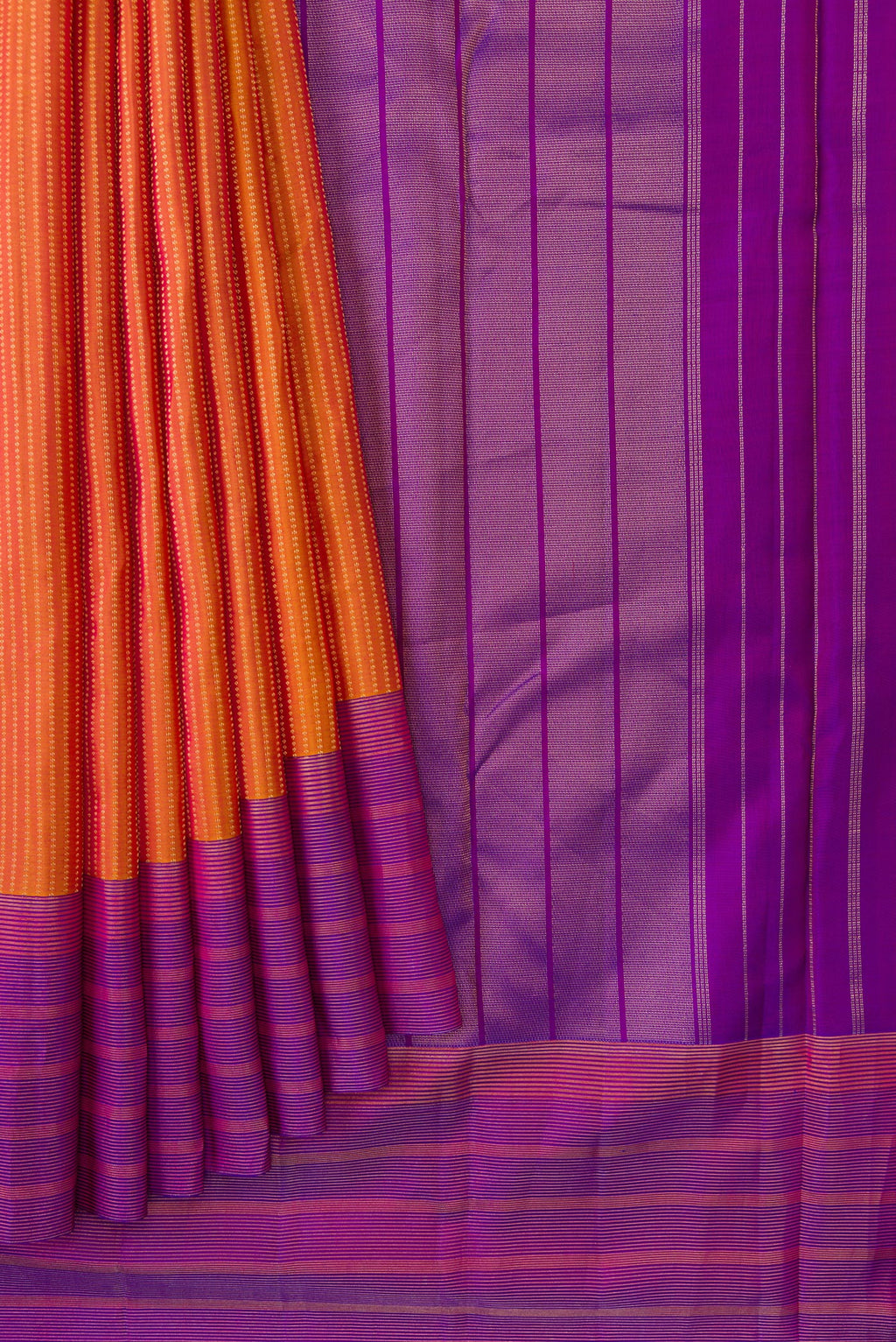 Pleats and pallu of Mustard Dual Tone Kanchipuram Silk Saree with Stripes on the body and Zari Border. 