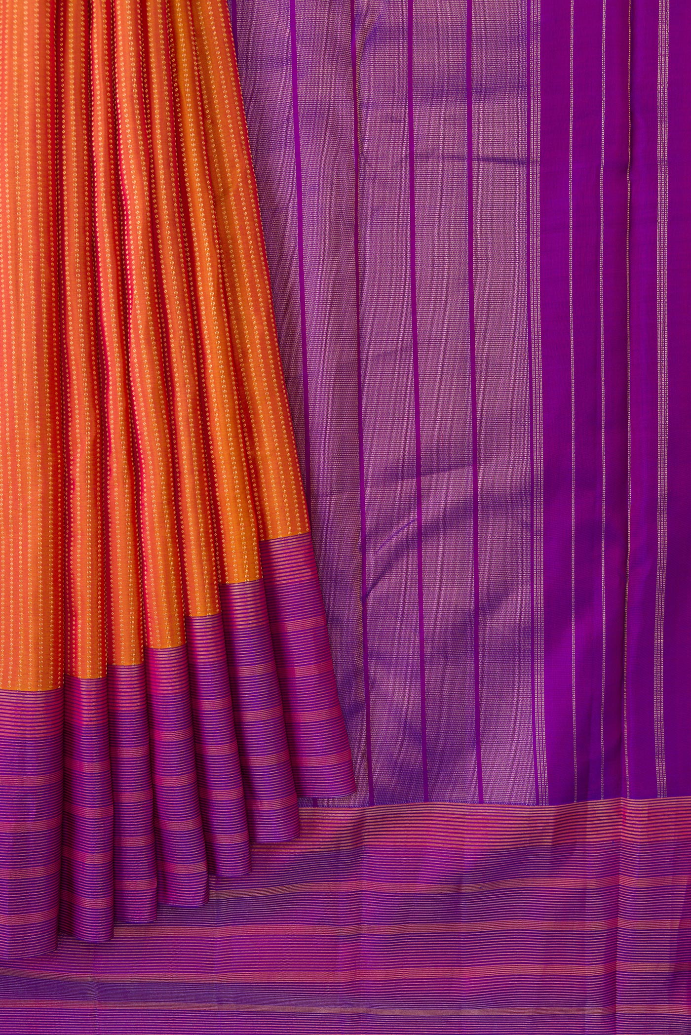 Pleats and pallu of Mustard Dual Tone Kanchipuram Silk Saree with Stripes on the body and Zari Border. 
