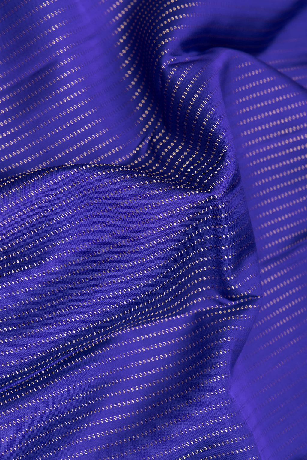 Close up of Royal Blue Dual Tone Kanchipuram Silk Saree with Stripes on the body and Zari Border.  displaying folds
