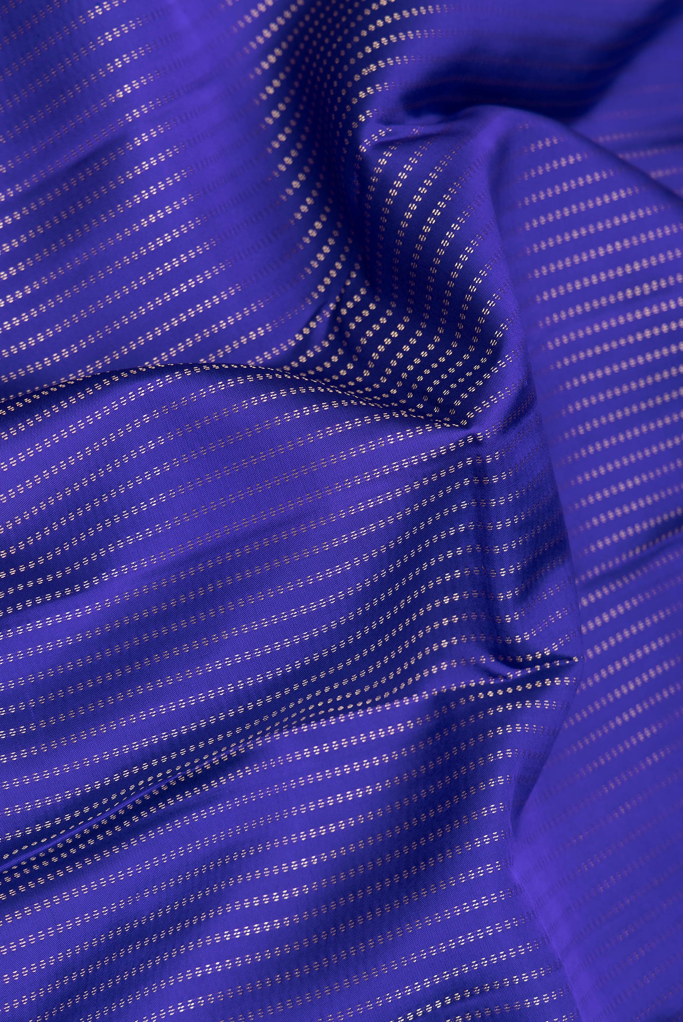 Close up of Royal Blue Dual Tone Kanchipuram Silk Saree with Stripes on the body and Zari Border.  displaying folds