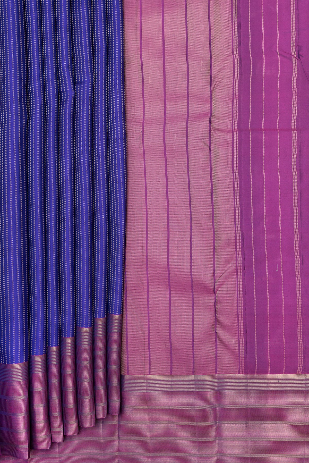 Pleats and pallu of Royal Blue Dual Tone Kanchipuram Silk Saree with Stripes on the body and Zari Border. 