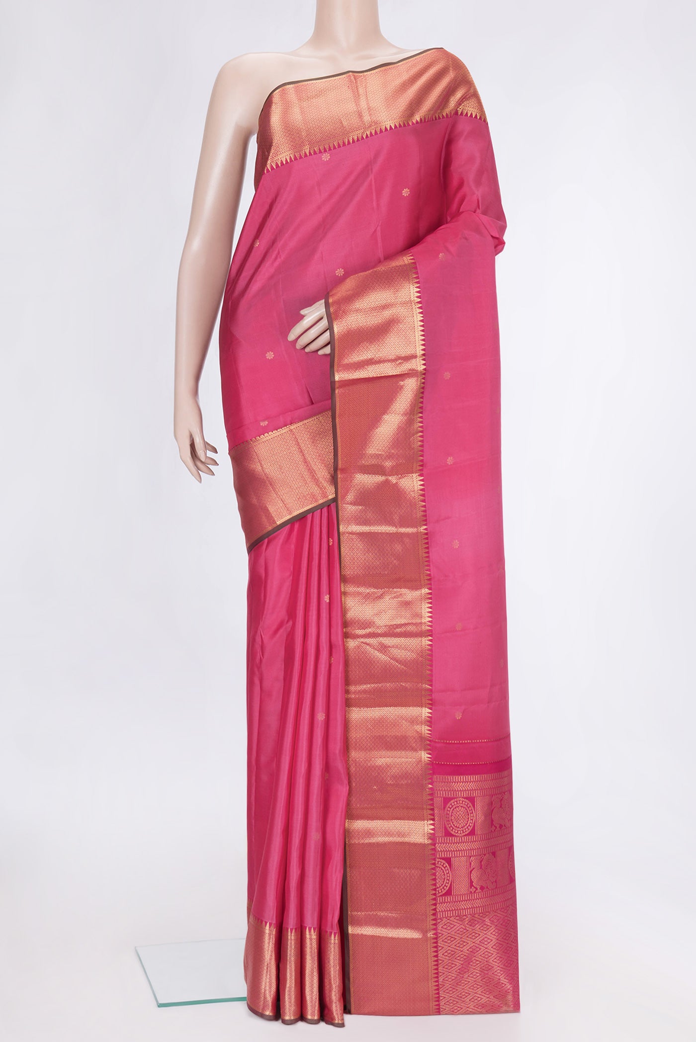 Pink Dual Tone Kanchipuram Silk Saree with Stripes on the body and Zari Border.  displayed on a mannequin