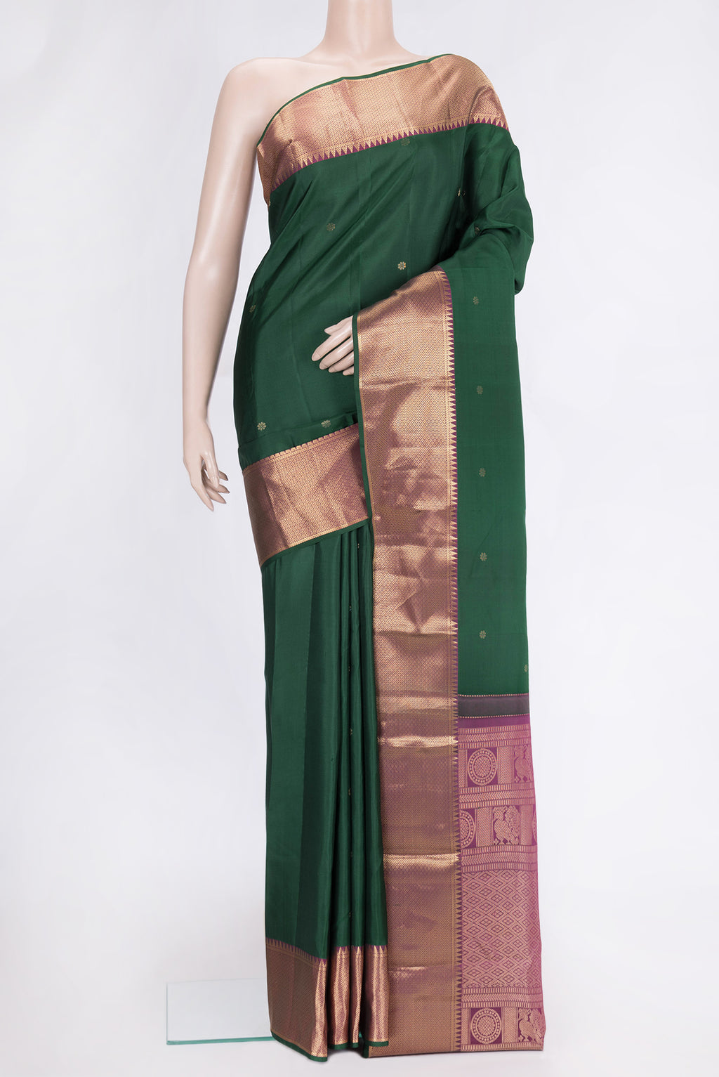 Green Dual Tone Kanchipuram Silk Saree with Zari Butta on the body and Zari Border.  displayed on a mannequin