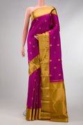 Magenta Dual Tone Kanjivaram Silk Saree with Zari Butta on the body and Zari Border.  displayed on a mannequin