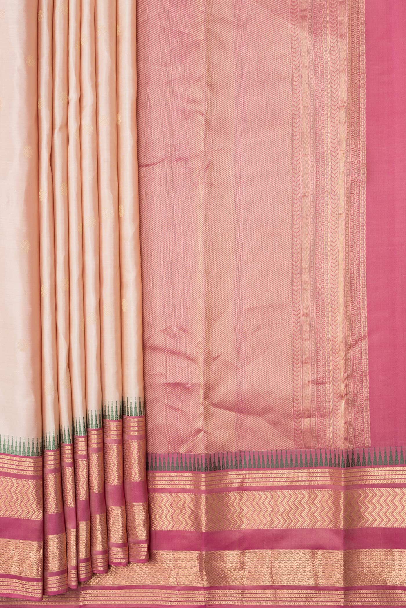 Pleats and pallu of Beige Dual Tone Kanjivaram Silk Saree with Zari Butta on the body and Zari Border. 