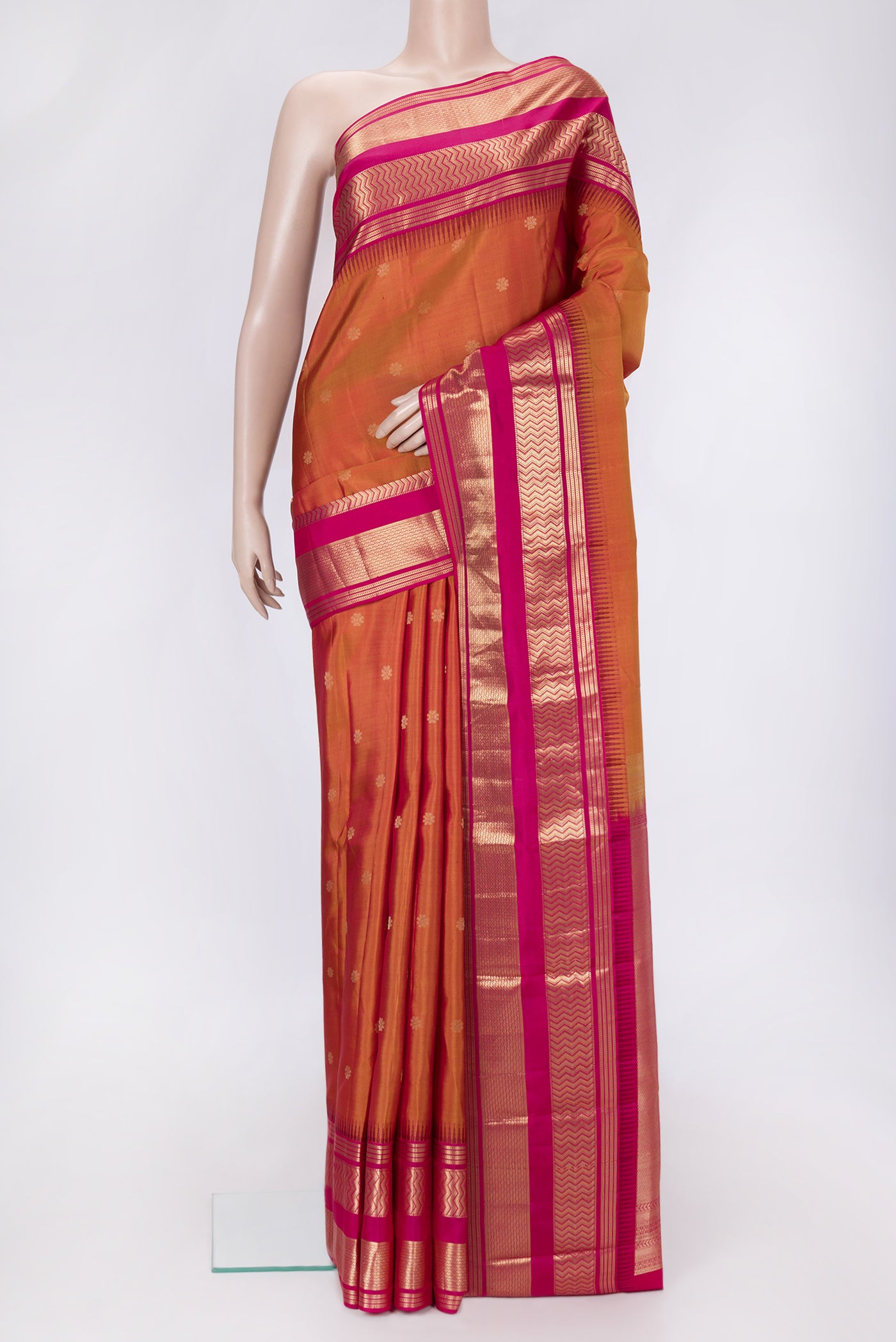 Mustard Dual Tone Kanjivaram Silk Saree with Zari Butta on the body and Zari Border.  displayed on a mannequin