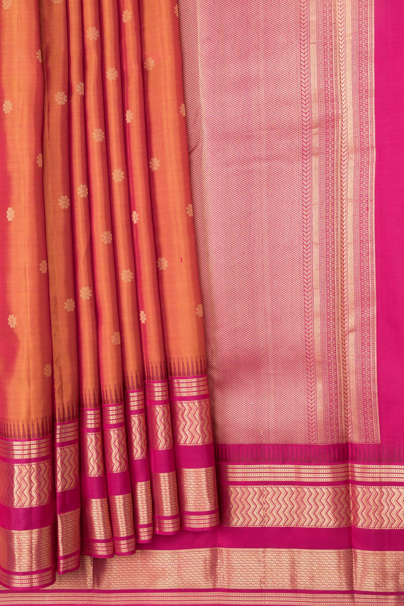 Pleats and pallu of Mustard Dual Tone Kanjivaram Silk Saree with Zari Butta on the body and Zari Border. 