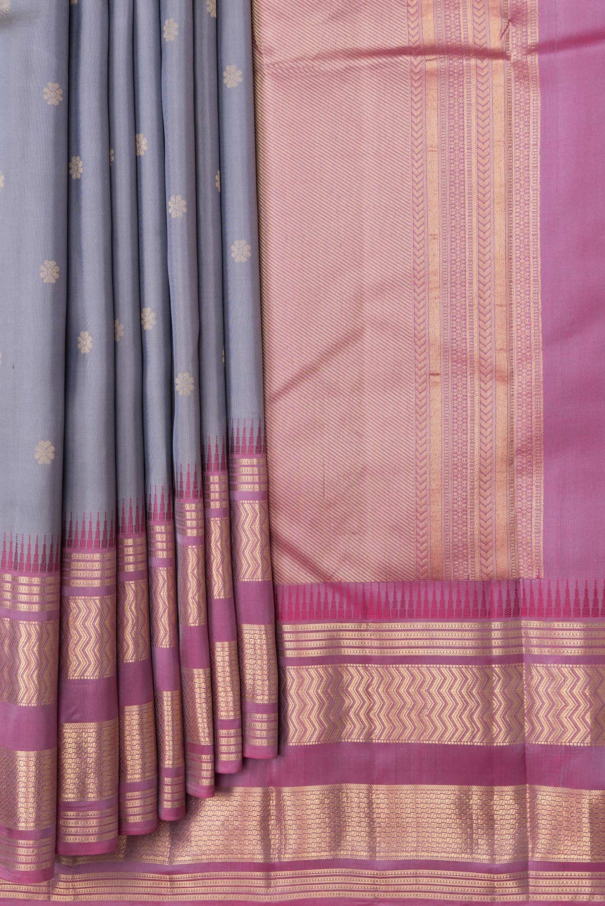 Pleats and pallu of Grey Dual Tone Kanjivaram Silk Saree with Zari Butta on the body and Zari Border. 