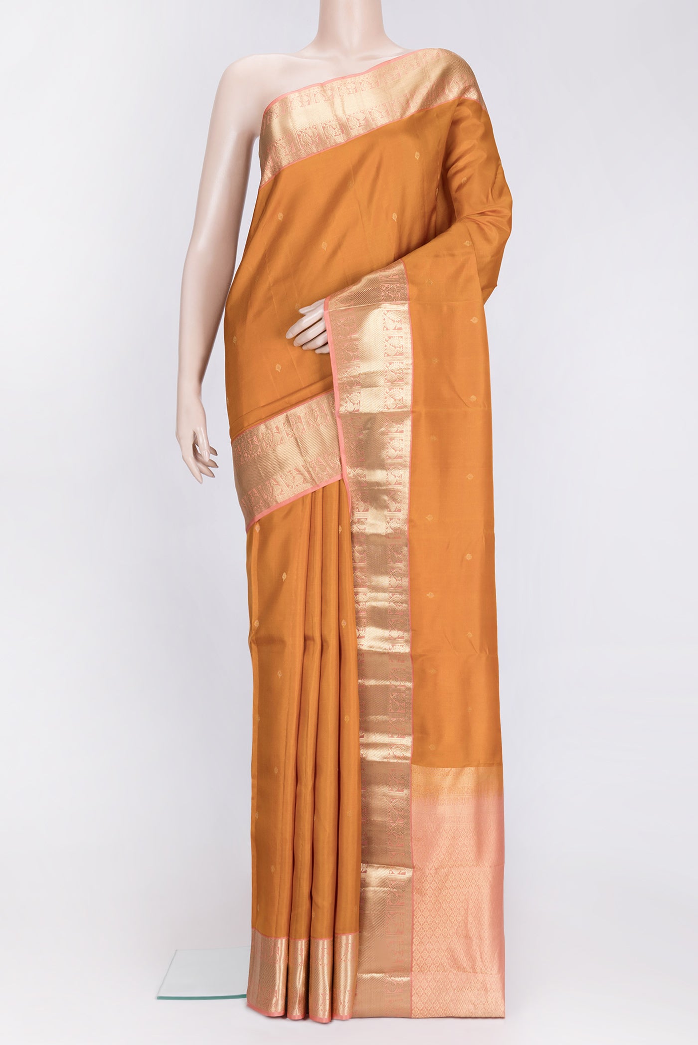 Mustard Dual Tone Kanchipuram Silk Saree with Zari Butta on the body and Zari Border.  displayed on a mannequin