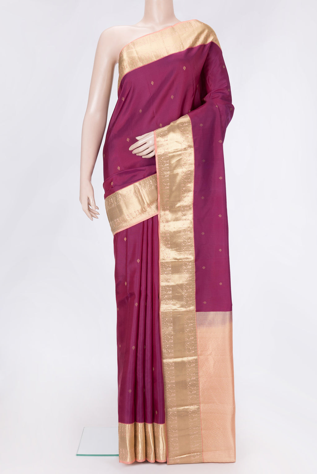 Magenta Dual Tone Kanchipuram Silk Saree with Zari Butta on the body and Zari Border.  displayed on a mannequin