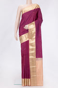 Magenta Dual Tone Kanchipuram Silk Saree with Zari Butta on the body and Zari Border.  displayed on a mannequin