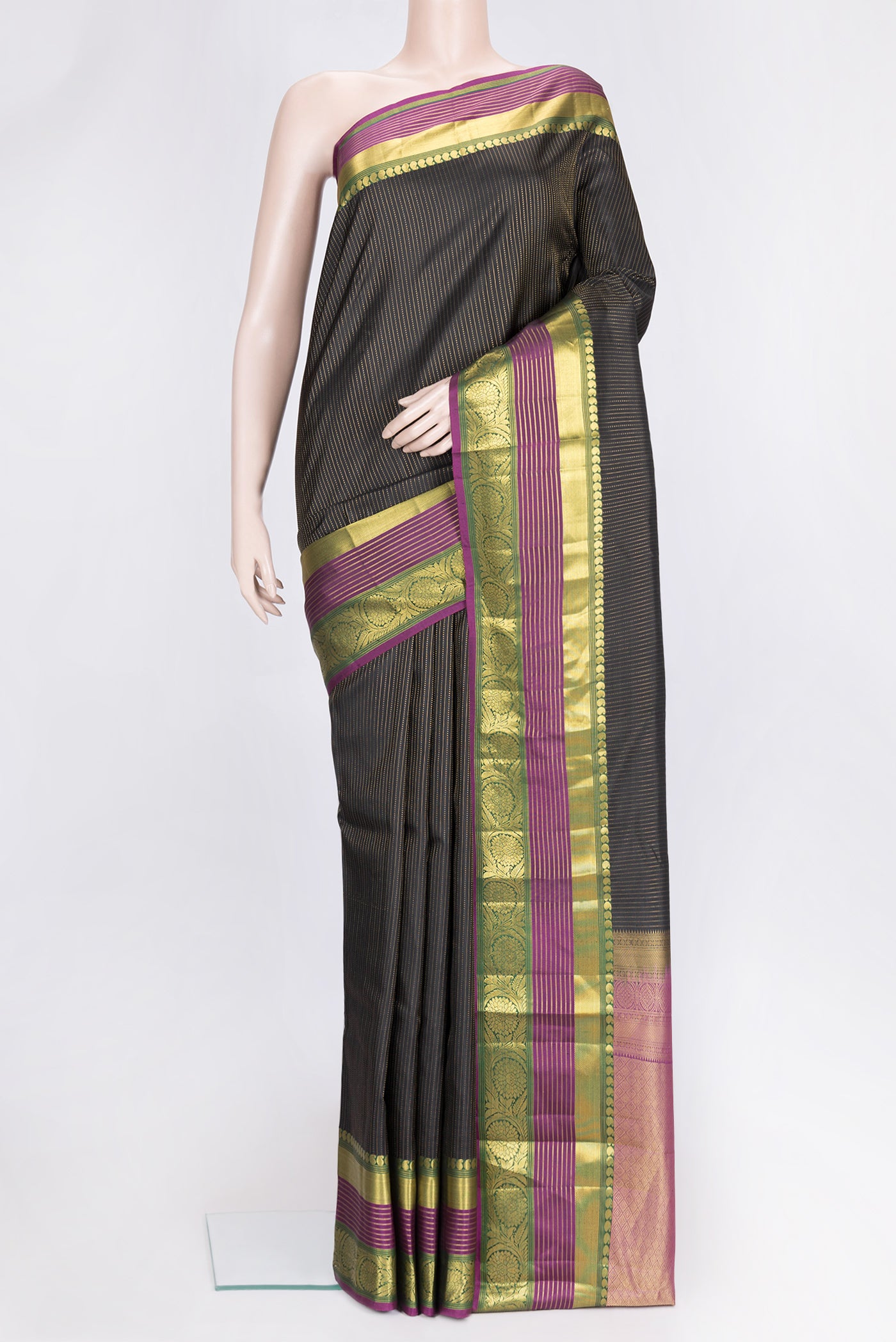 Black Dual Tone Kanjivaram Silk Saree with Stripes on the body and Zari Border.  displayed on a mannequin