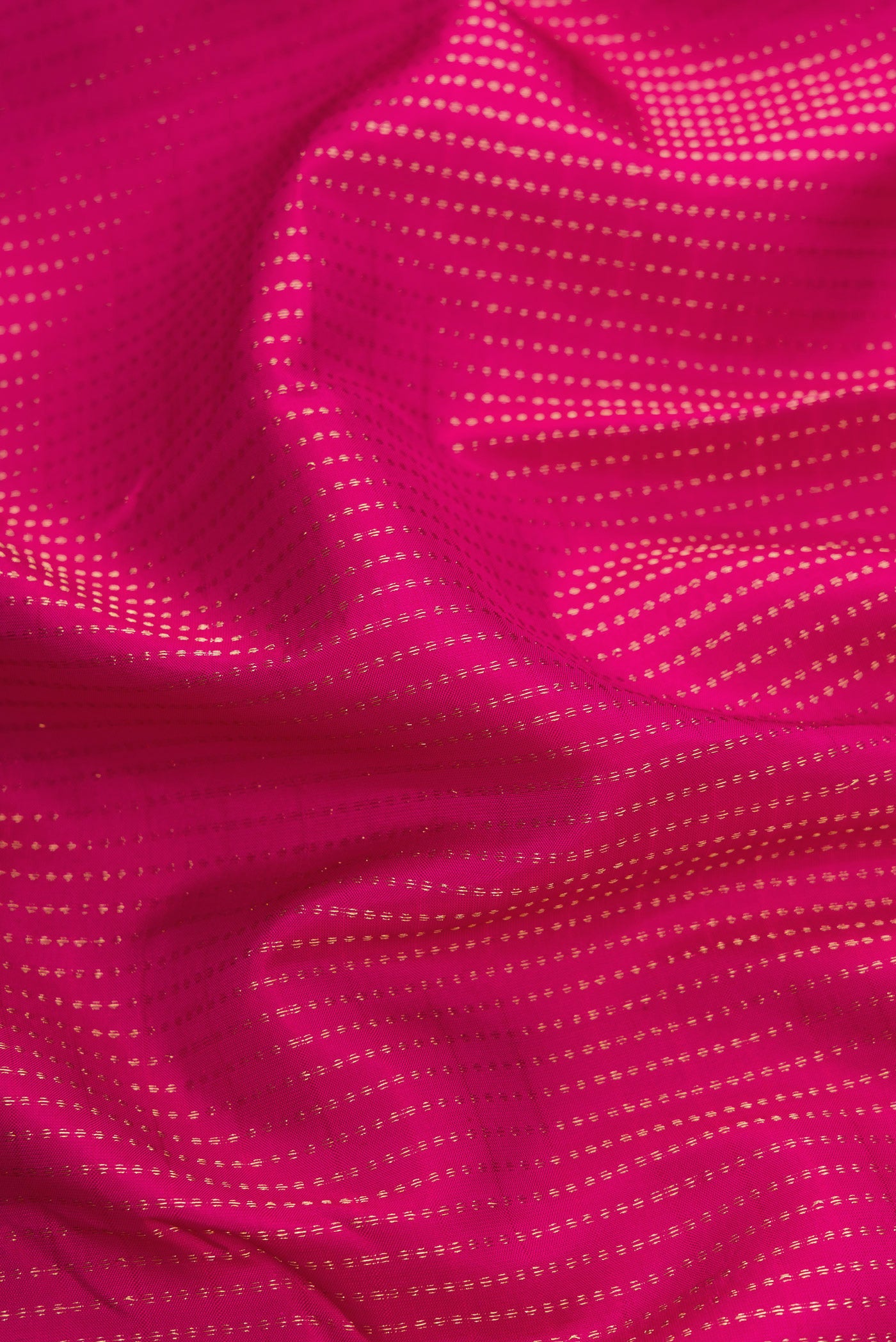 Close up of Pink Dual Tone Kanchipuram Silk Saree with Stripes on the body and Zari Border.  displaying folds