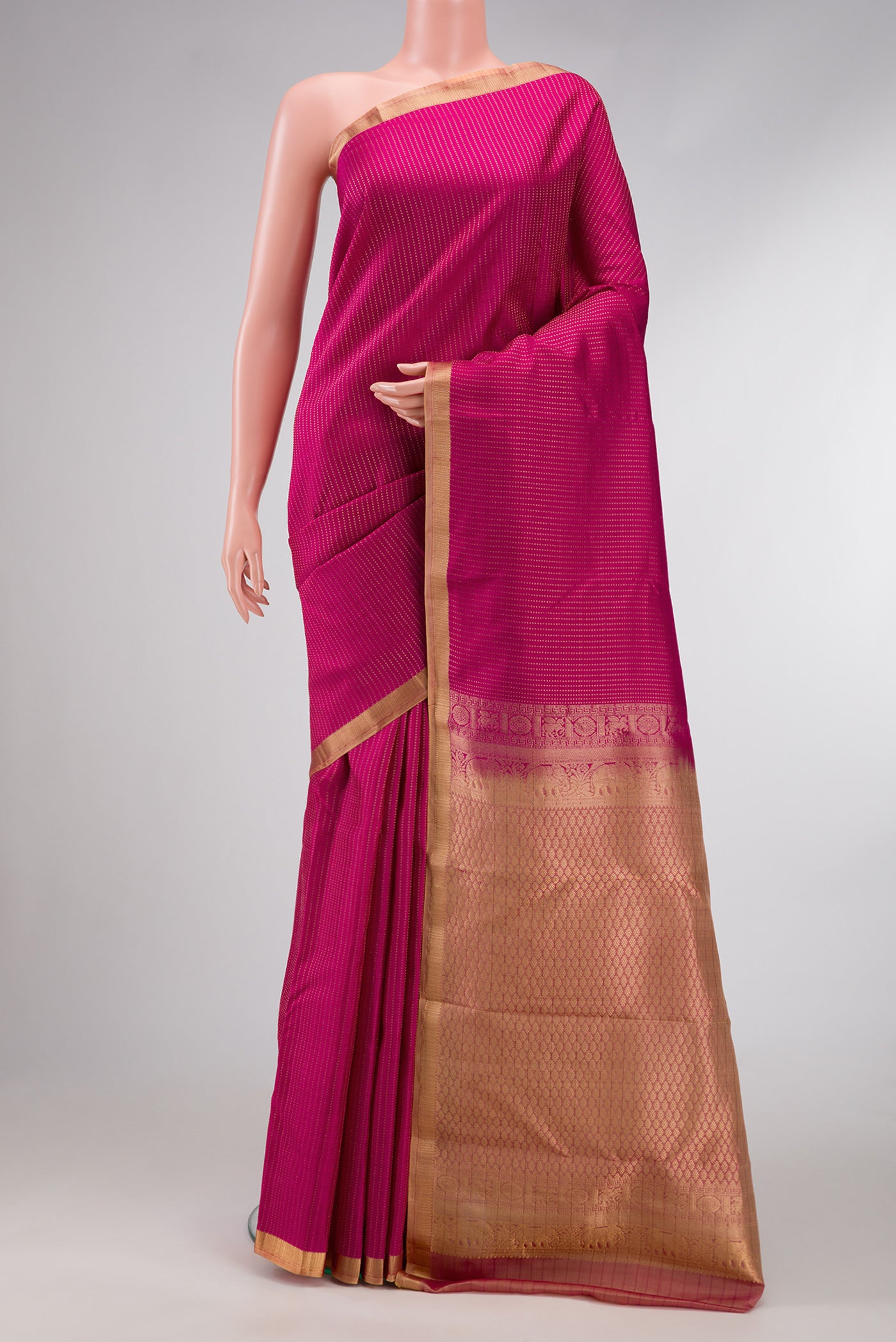 Pink Dual Tone Kanchipuram Silk Saree with Stripes on the body and Zari Border.  displayed on a mannequin