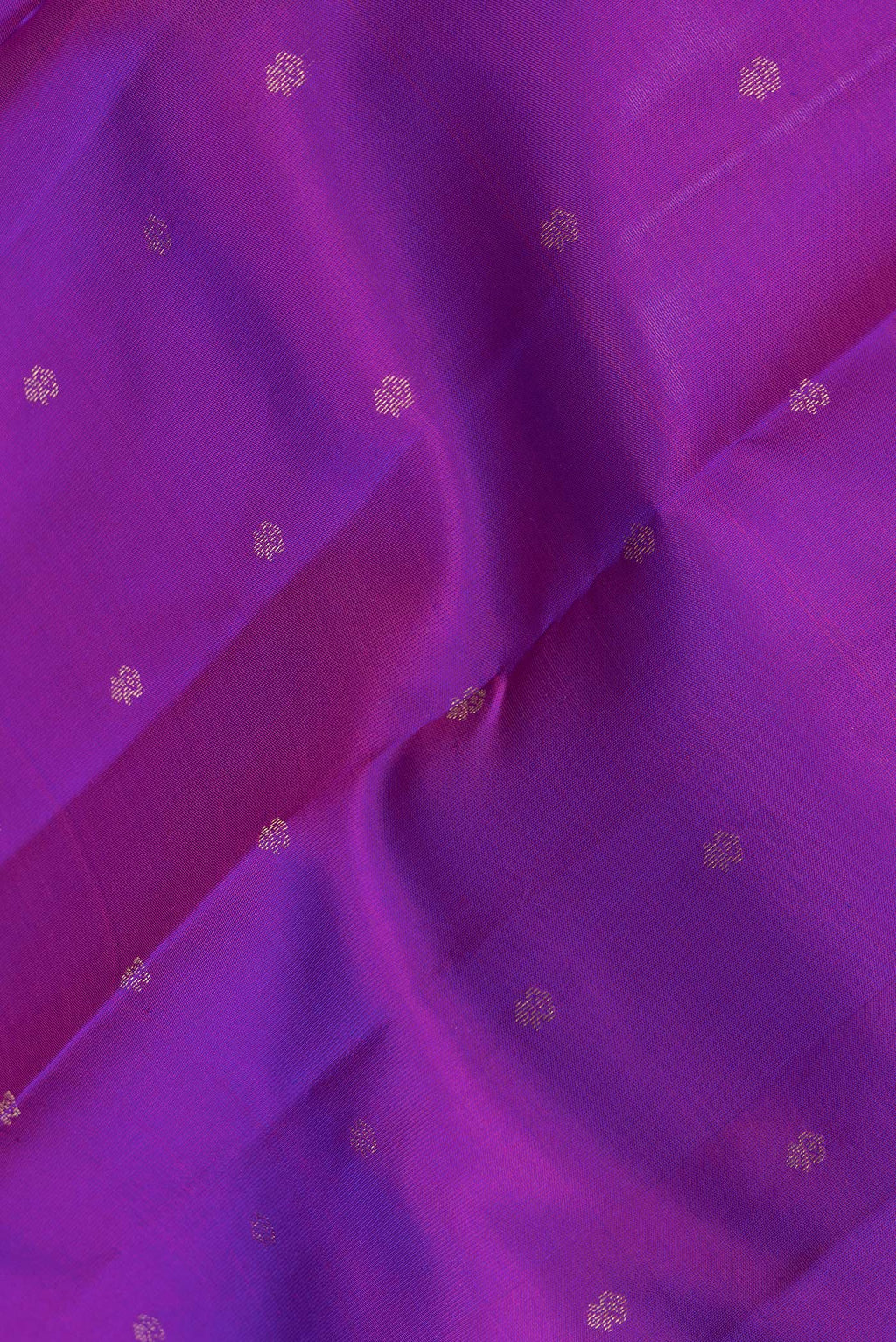 Close up of Purple Dual Tone Kanchipuram Silk Saree with Zari Butta on the body and Zari Border.  displaying folds