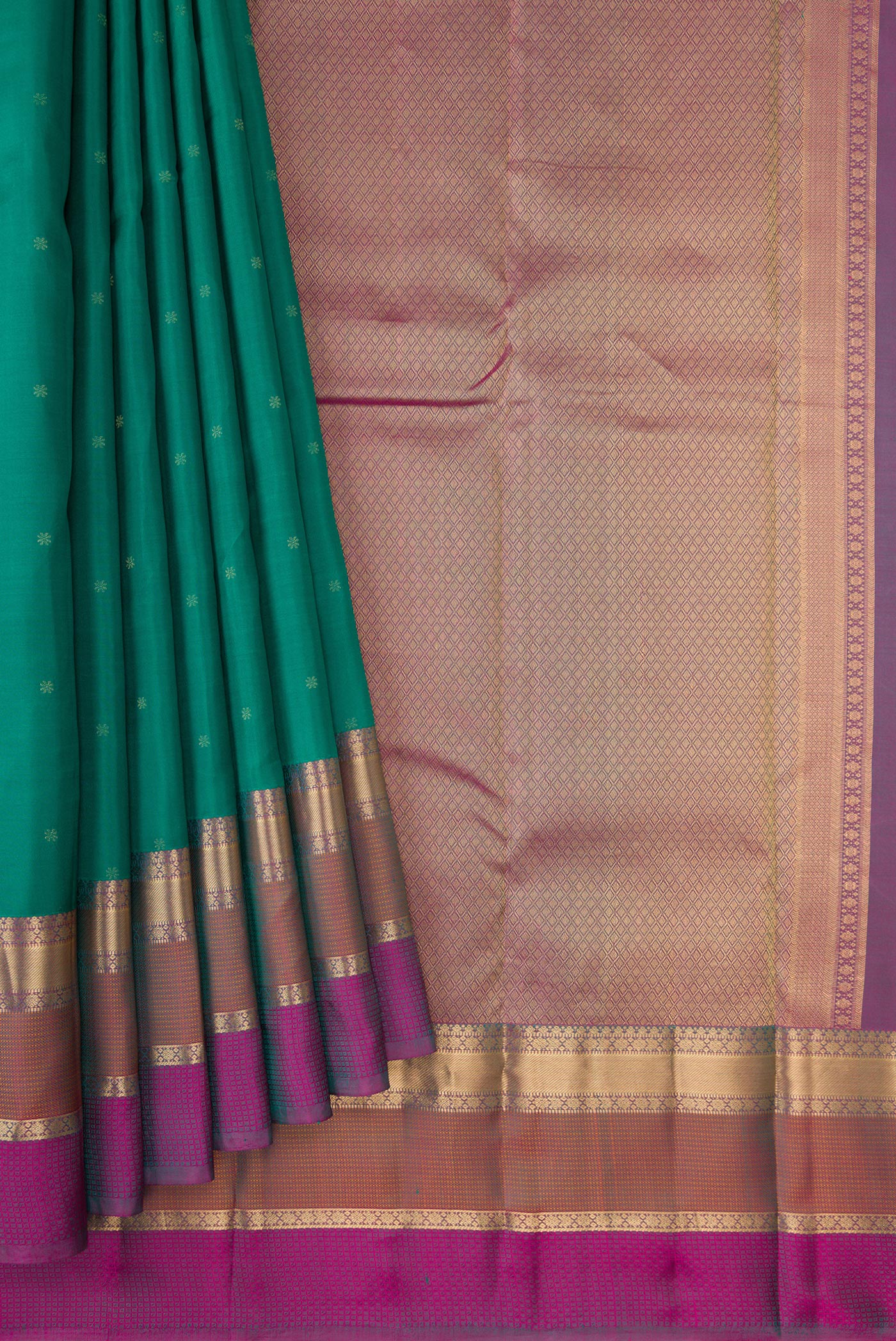 Pleats and pallu of Green Dual Tone Kanchipuram Silk Saree with Zari Butta on the body and Zari Border. 