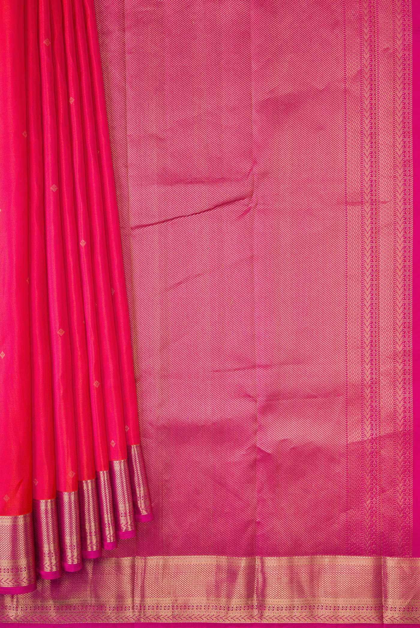 Pleats and pallu of Coral Dual Tone Kanchipuram Silk Saree with Zari Butta on the body and Zari Border. 