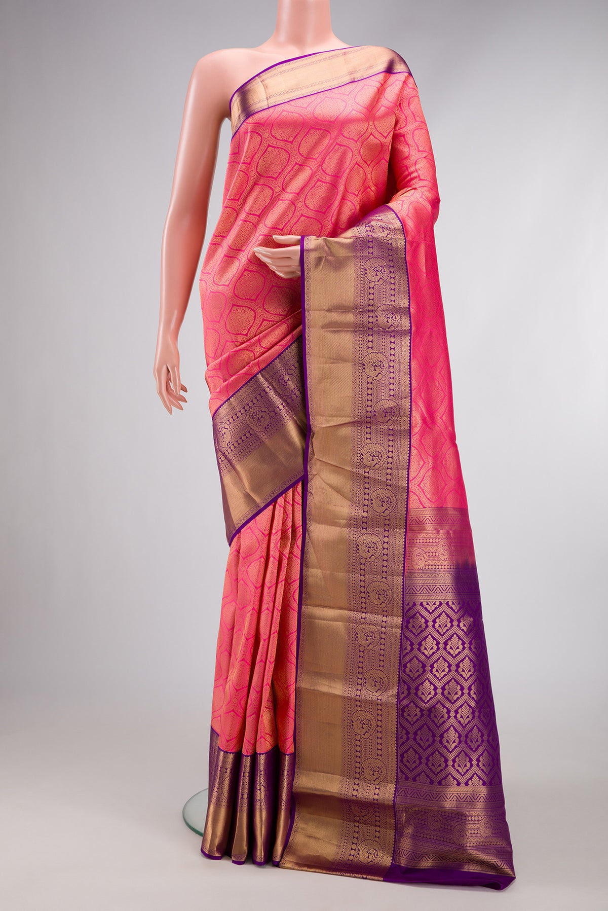 Pink Kanjivaram Silk Saree with Zari Brocade on the body and Zari Border.  displayed on a mannequin