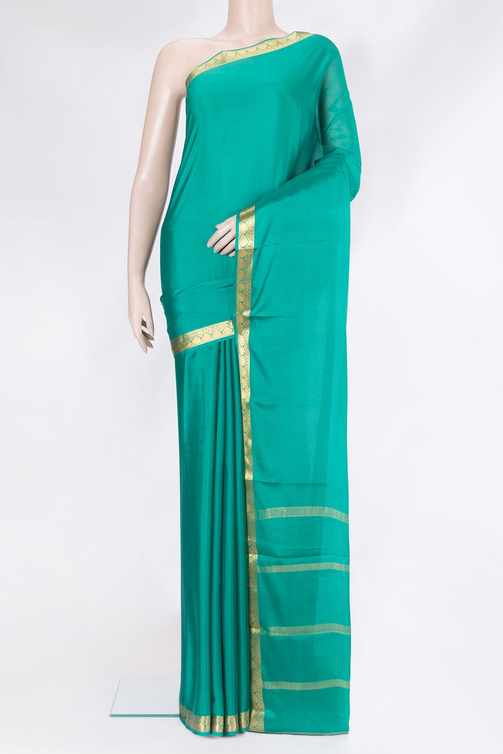 Sea Green Mysore Silk Saree with Plain Body and Zari Border.  displayed on a mannequin