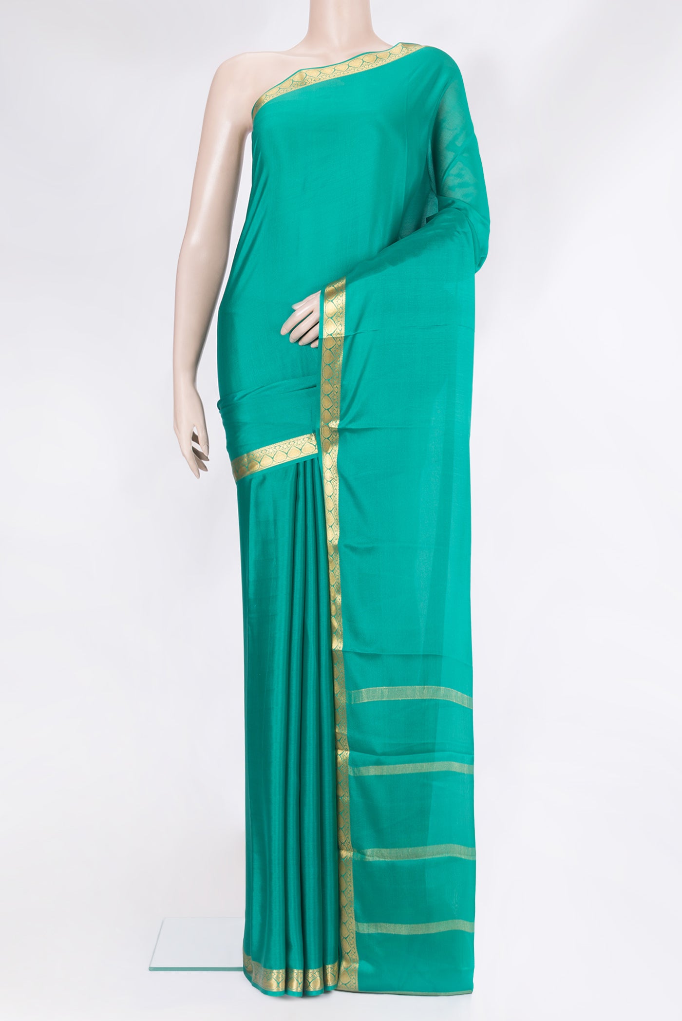 Sea Green Mysore Silk Saree with Plain Body and Zari Border.  displayed on a mannequin