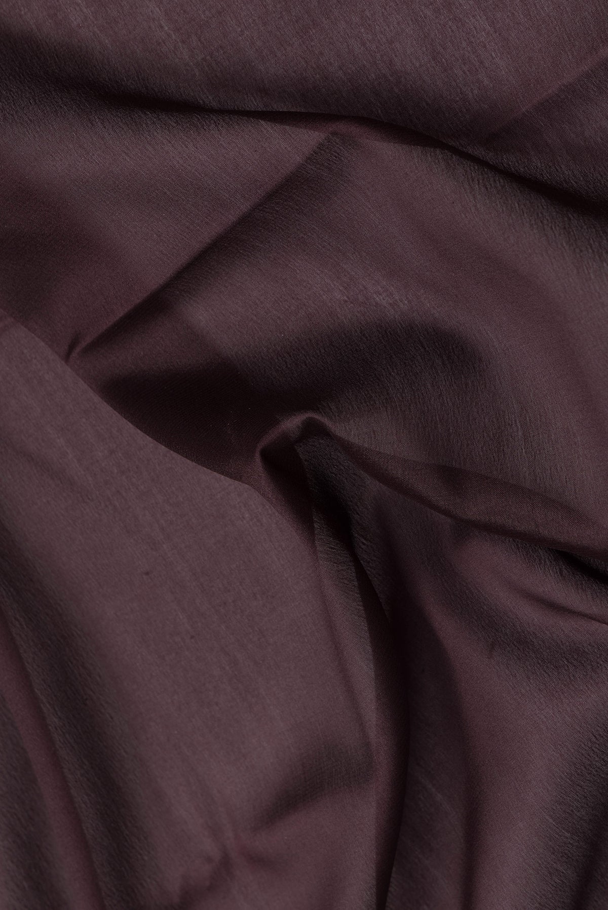 Close up of Coffee Brown Dual Tone Mysore Silk Saree with Plain Body and Zari Border.  displaying folds