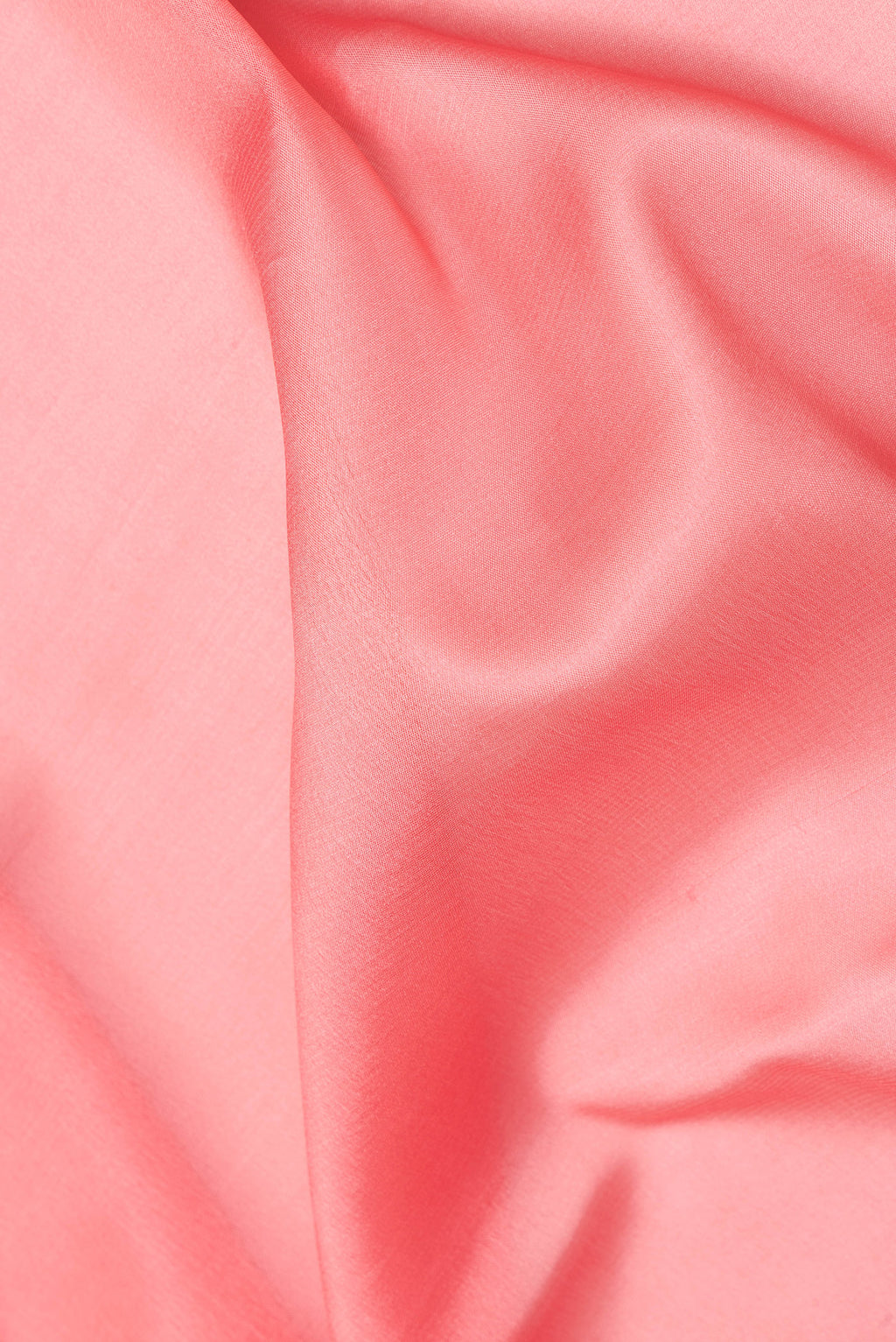 Close up of Peach Mysore Crepe Saree with Plain Body and Zari Border.  displaying folds