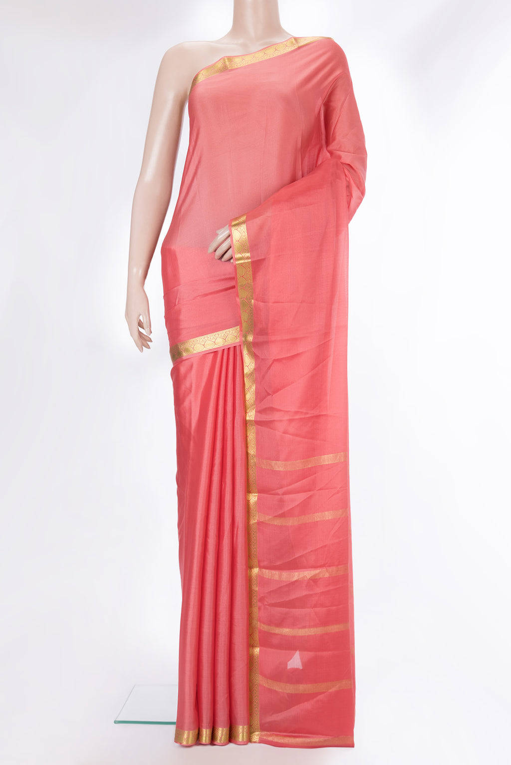 Peach Mysore Crepe Saree with Plain Body and Zari Border.  displayed on a mannequin