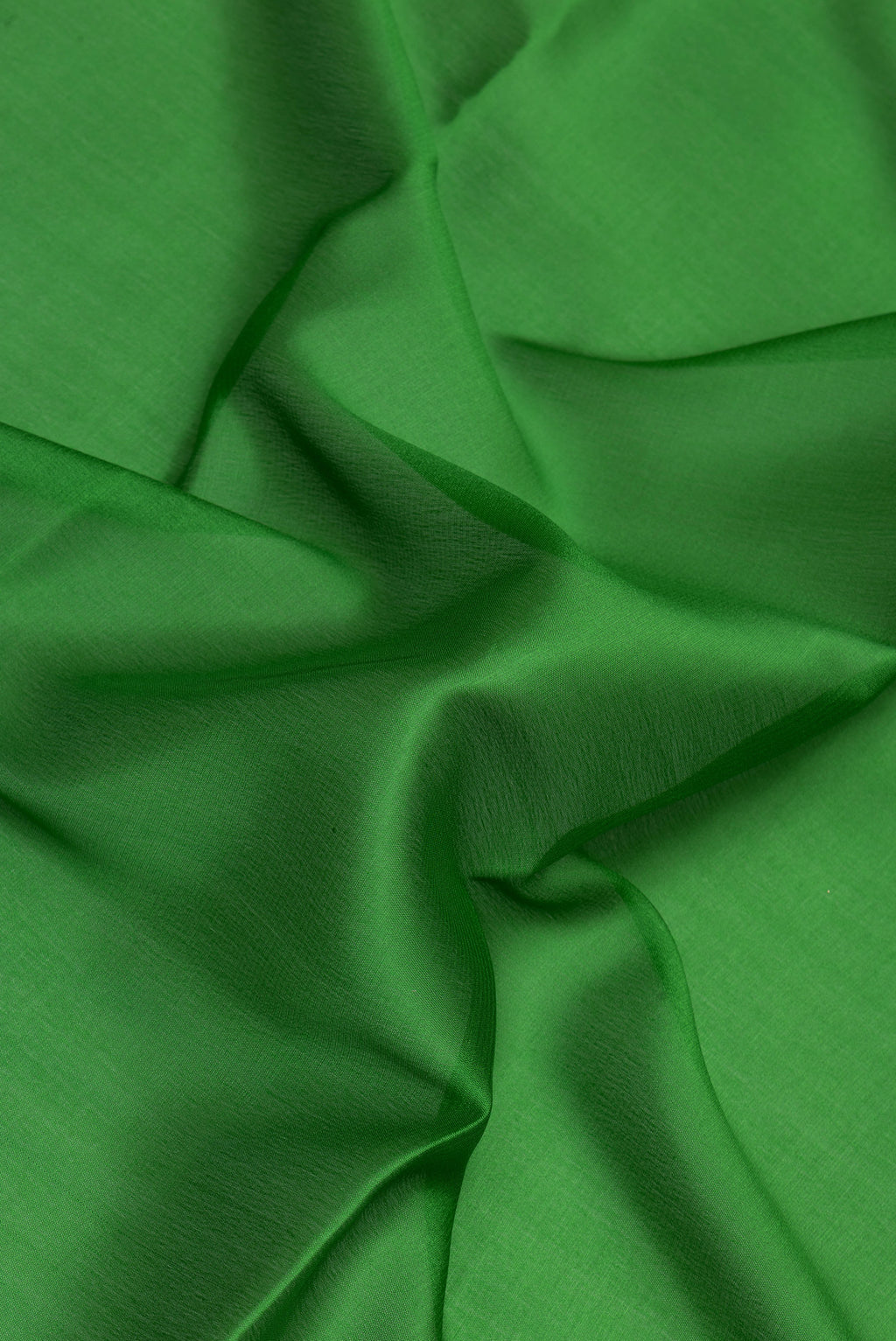 Close up of Green Mysore Silk Saree with Plain Body and Zari Border.  displaying folds