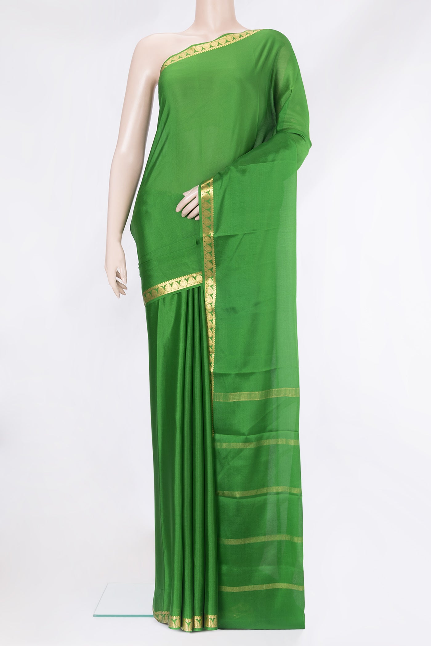 Green Mysore Silk Saree with Plain Body and Zari Border.  displayed on a mannequin
