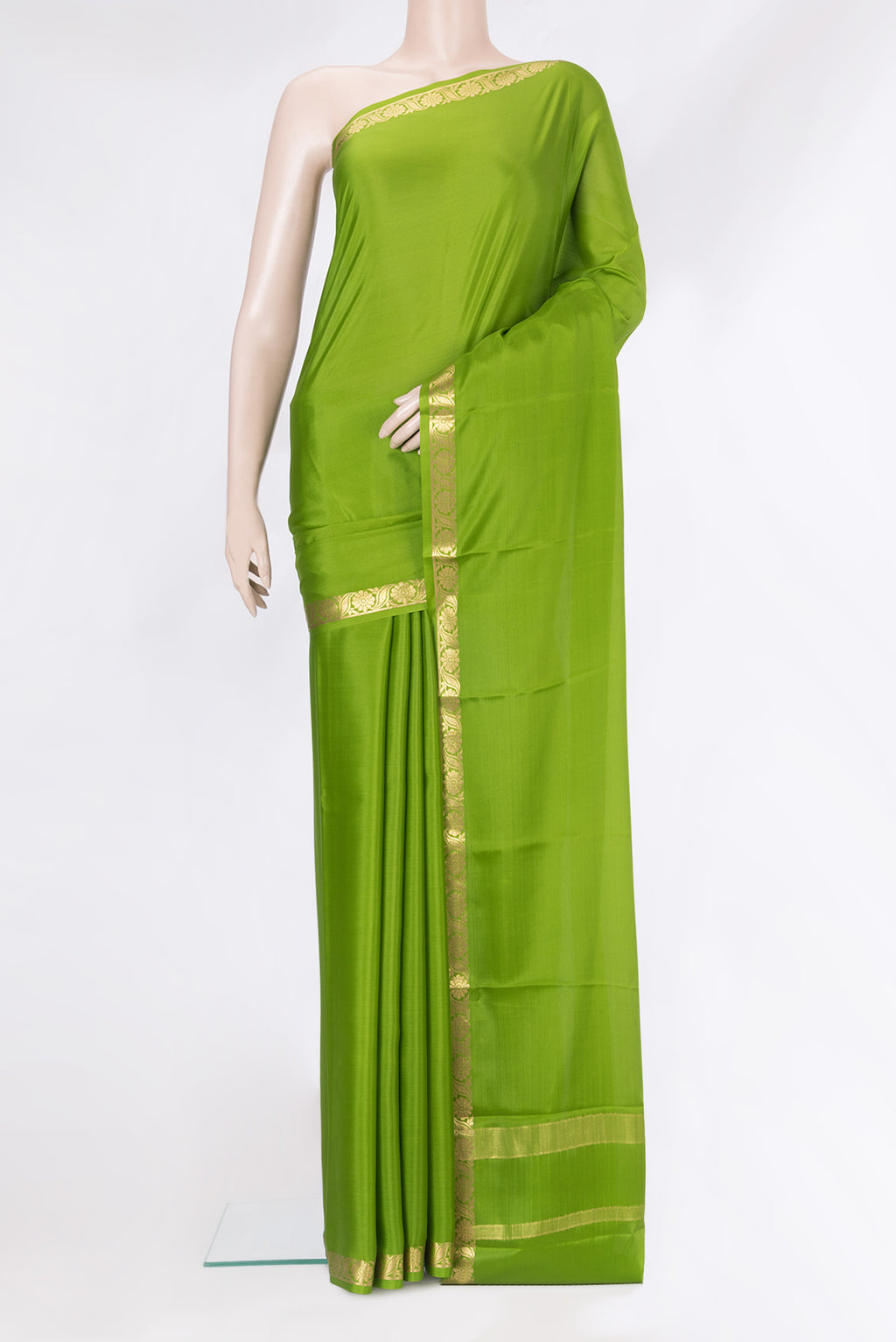 Parrot Green Mysore Silk Saree with Plain Body and Zari Border.  displayed on a mannequin