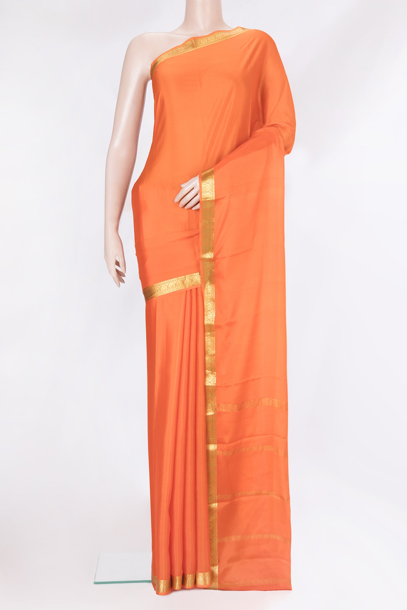 Orange Mysore Silk Saree with Plain Body and Zari Border.  displayed on a mannequin